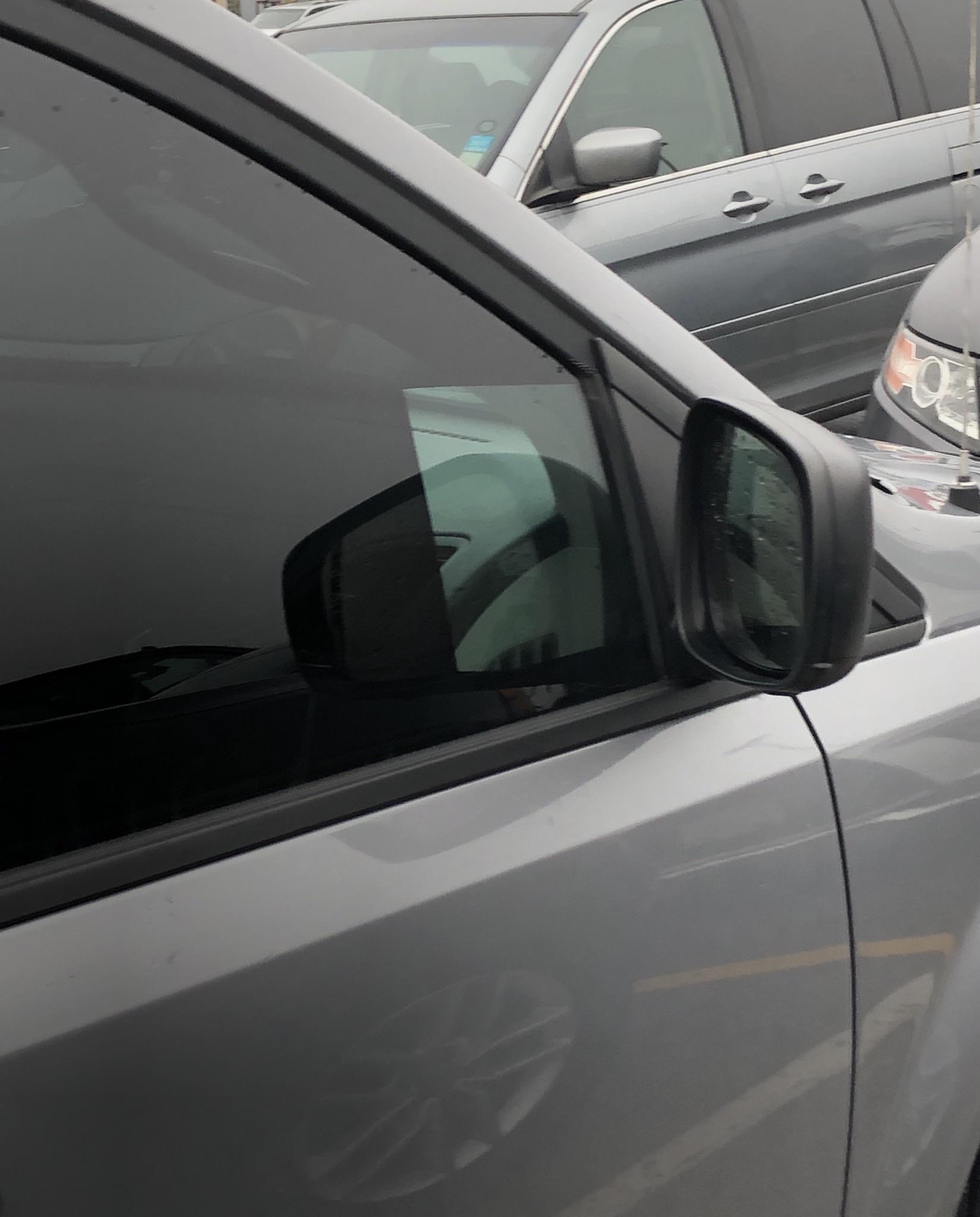 Someone cut a hole in their tint to see the mirror r/funny