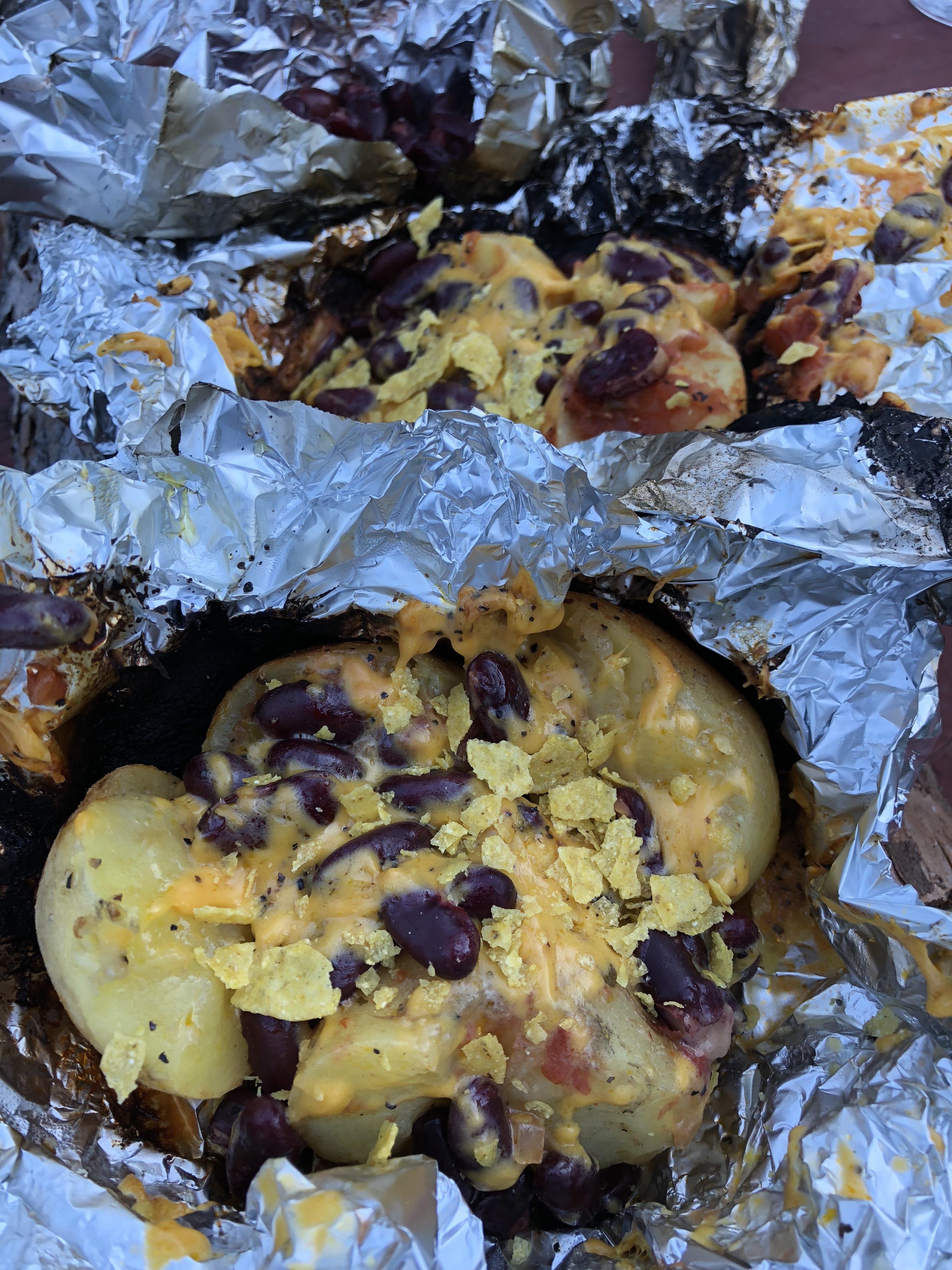 Vegan campfire! Baked potatoes with kidney beans, Daiya cheddar cheese and salsa! More info in