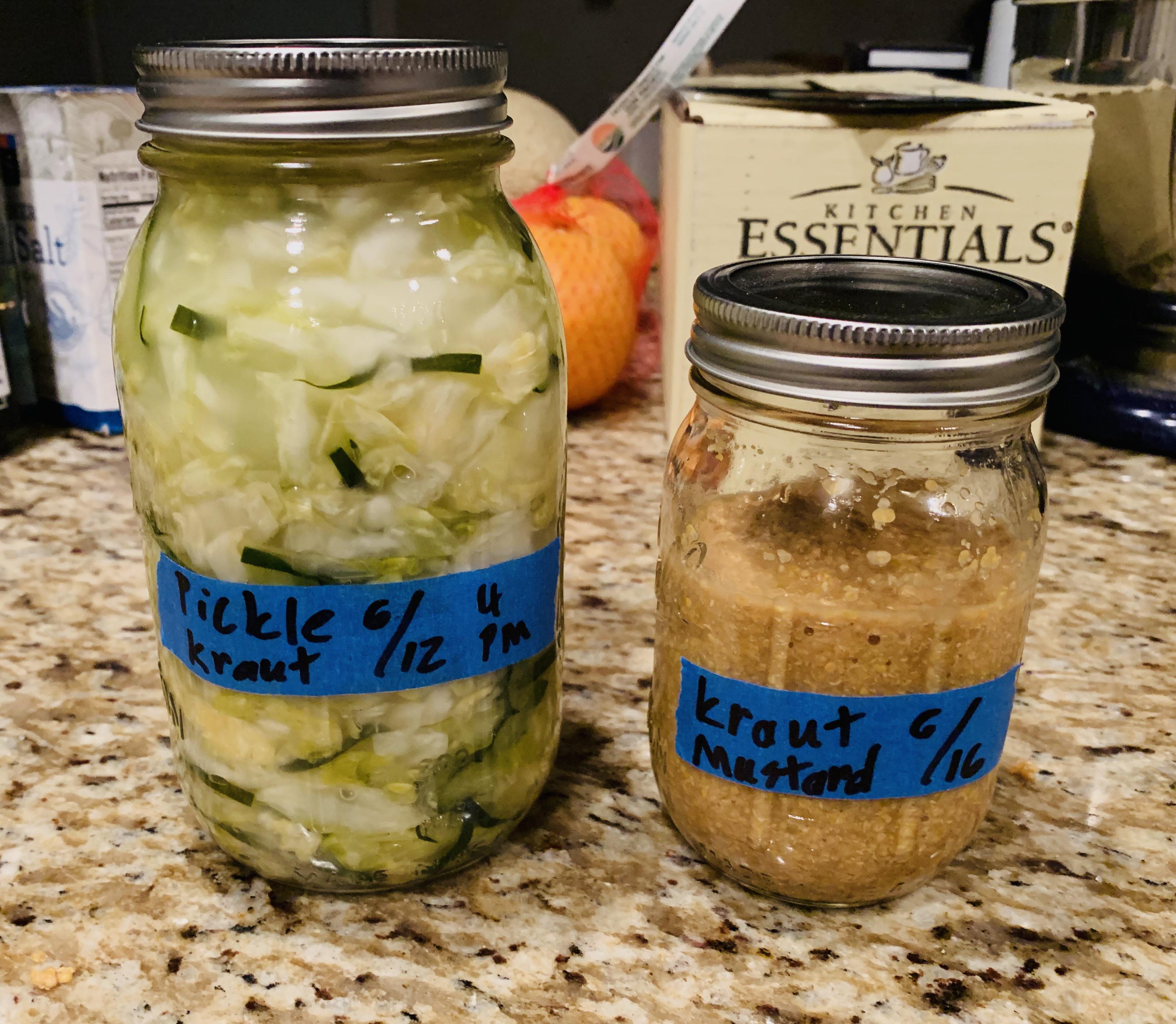 Cucumber and cabbage kraut, and mustard made with kraut juice. r
