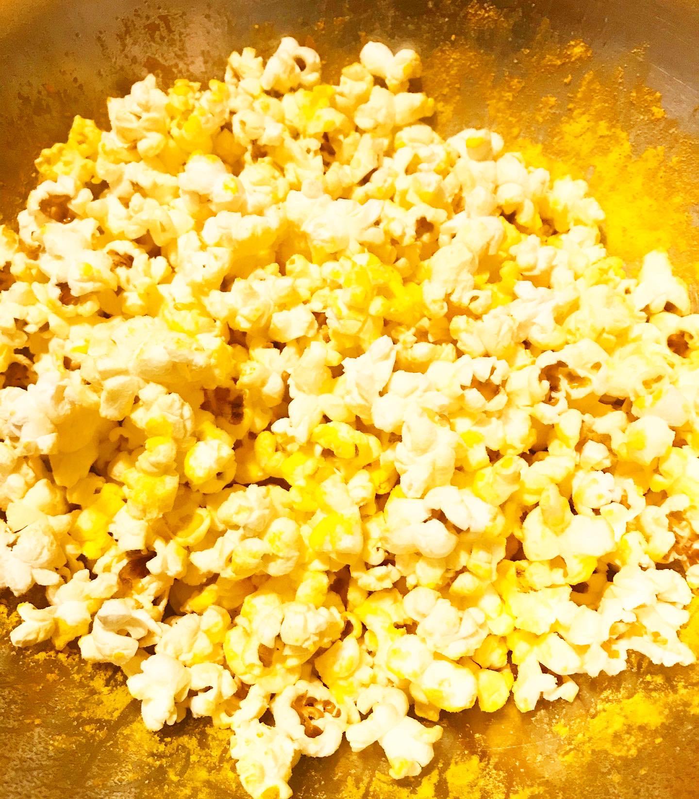 Use mac & cheese powder to season popcorn for a lighter snack to