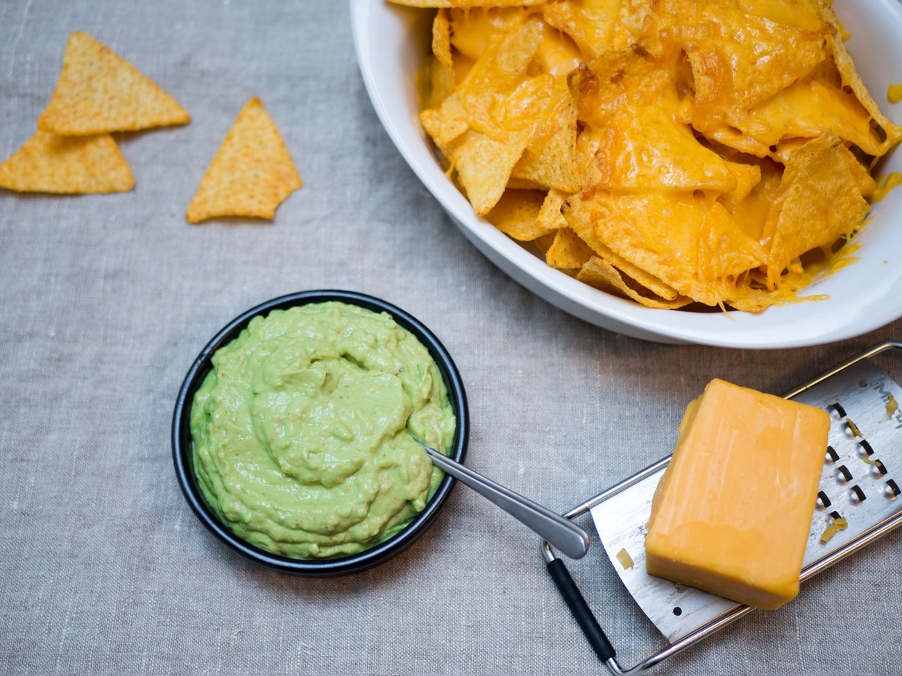 [Homemade] Guacamole and nachos with melted red cheddar cheese r/food