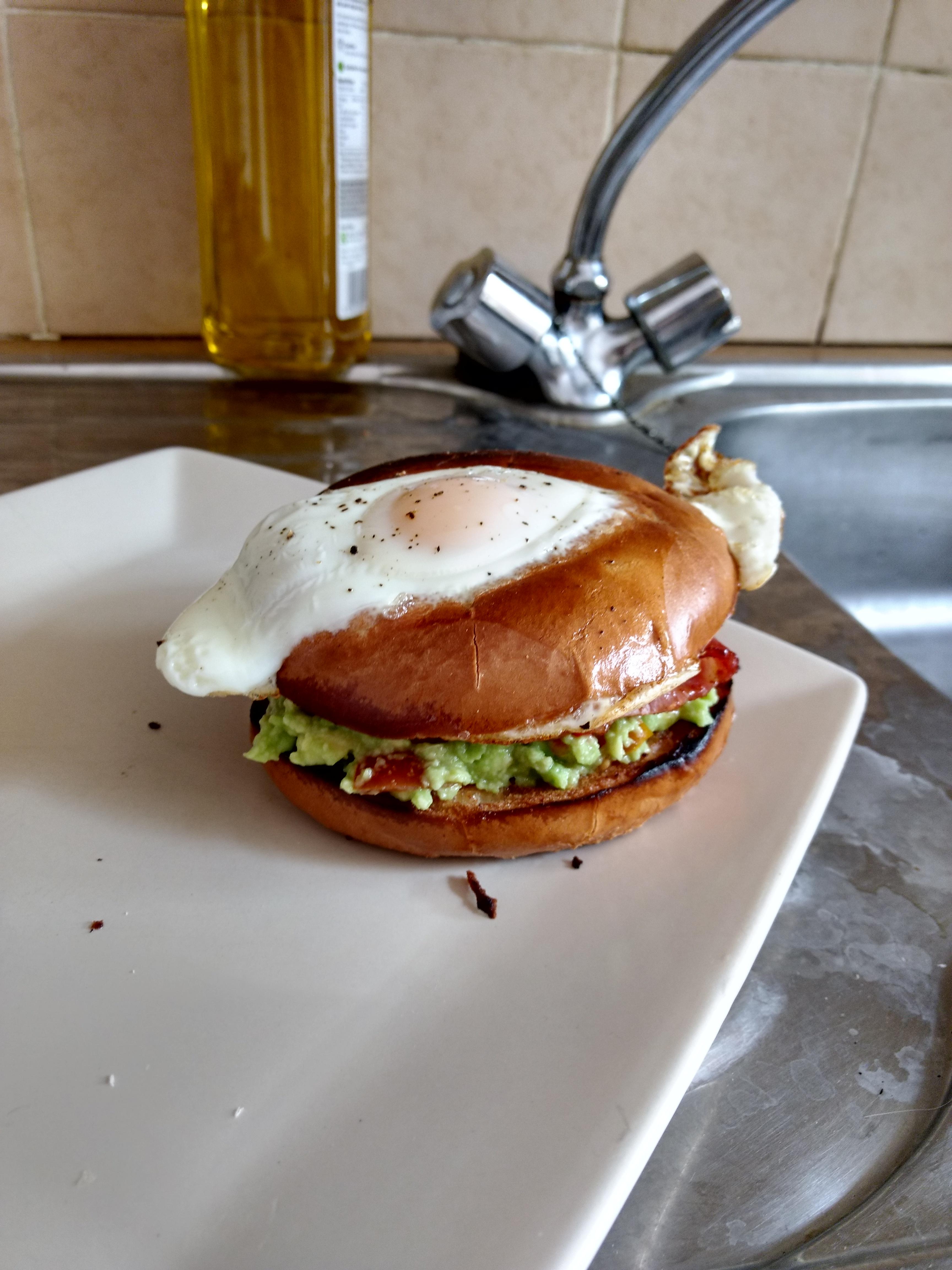 [Homemade] Egg in a hole (bagel with avocado, lime, tomatoes, bacon