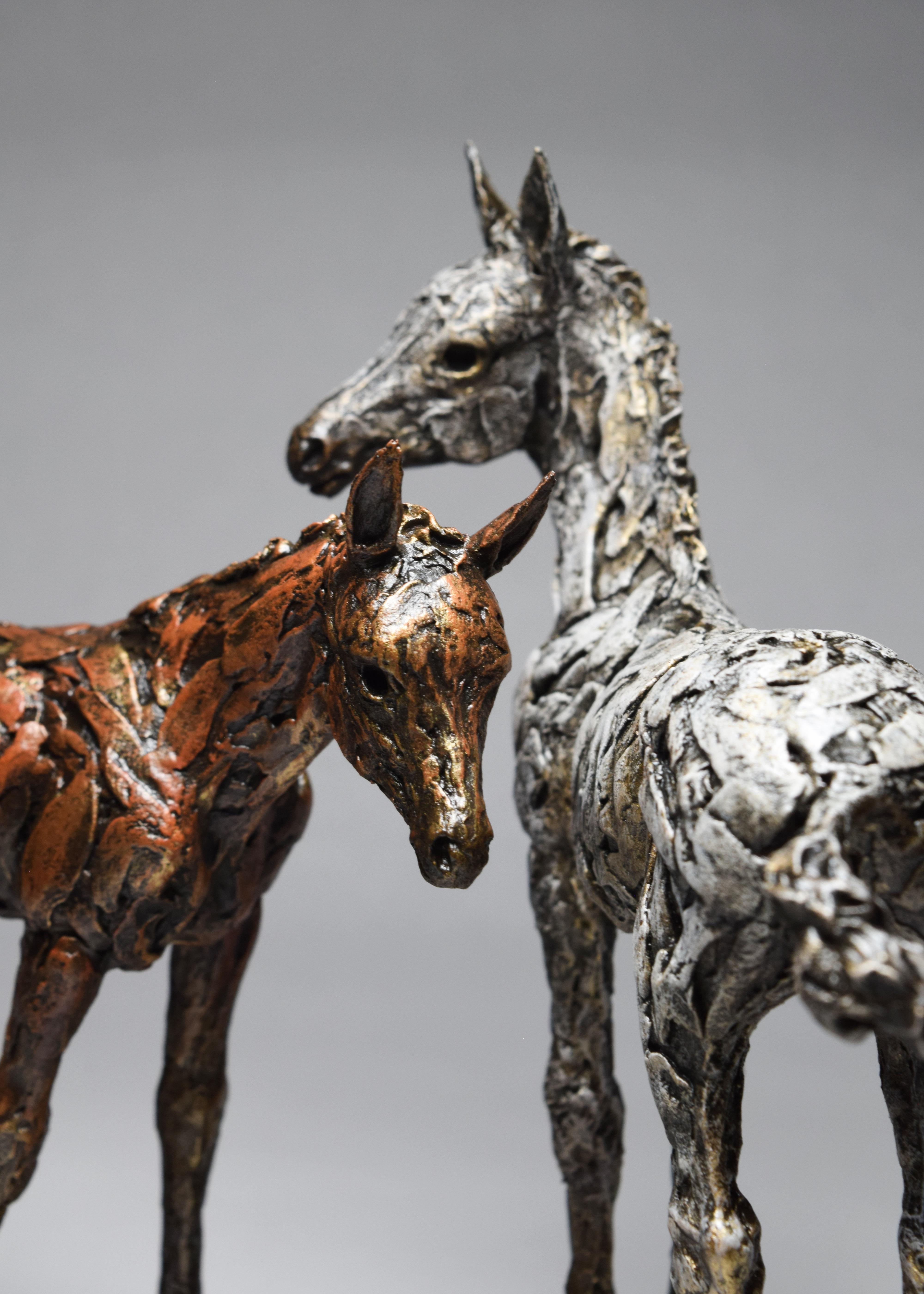 Closeup of 2 foal sculptures made using Japanese clay, my fingers