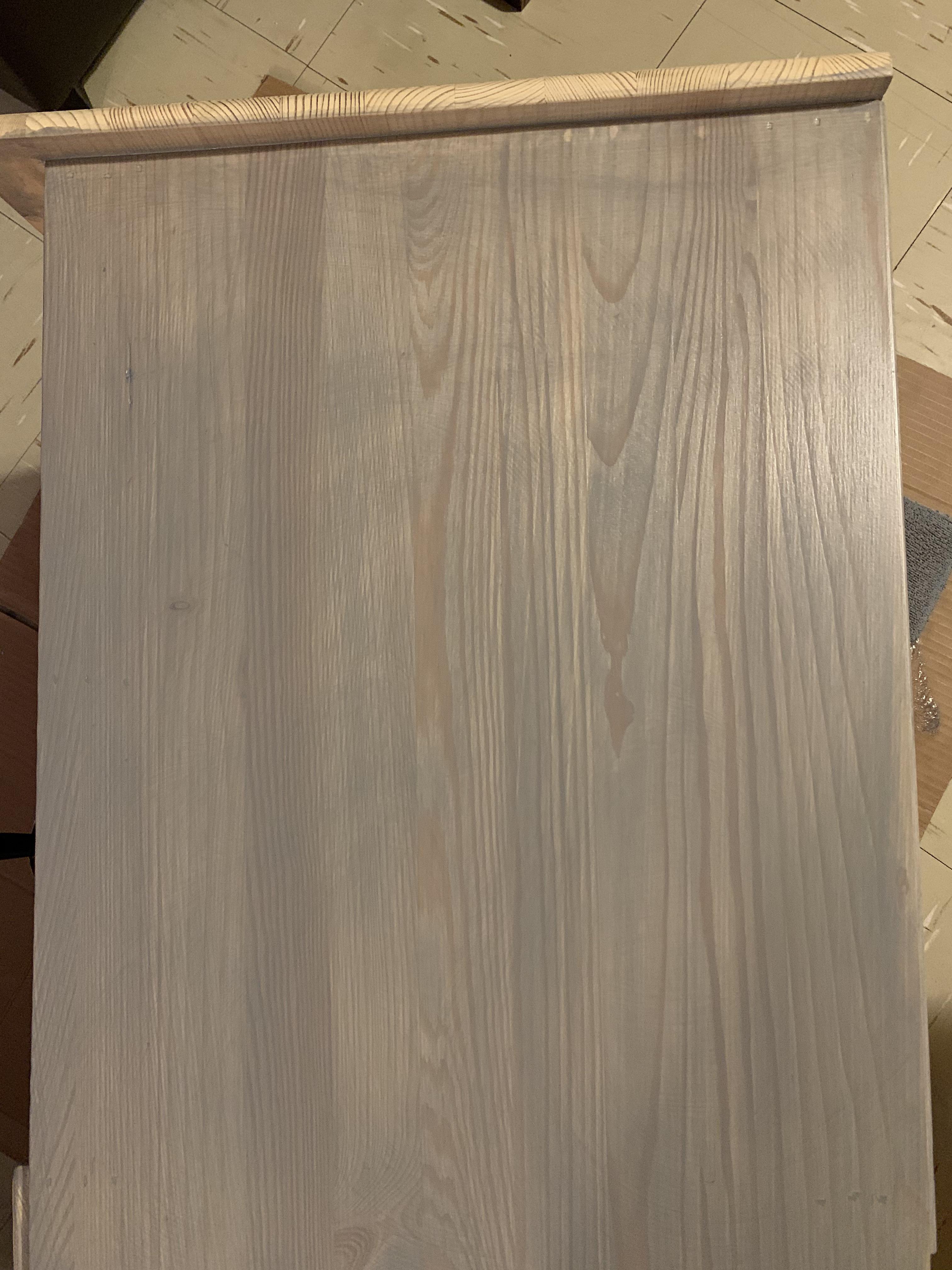 I used Varathane Stain + Poly in weathered grey on pine wood after