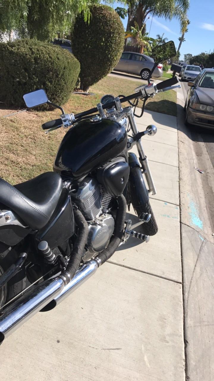 Bars, wrapped exhaust, and a little paint. Solo seat, rear fender, and