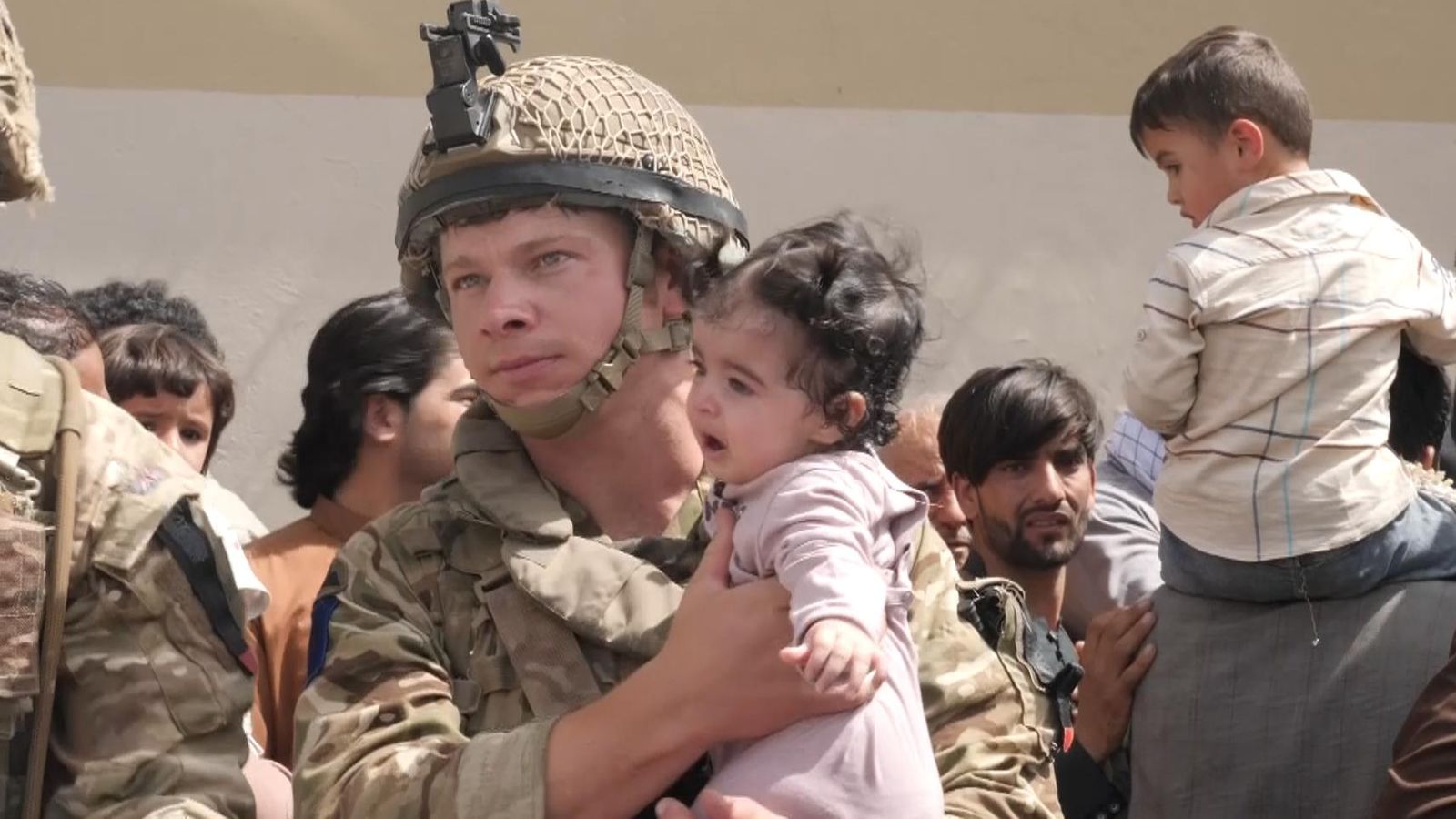 US and British soldiers saving children in Afghanistan. r/pics