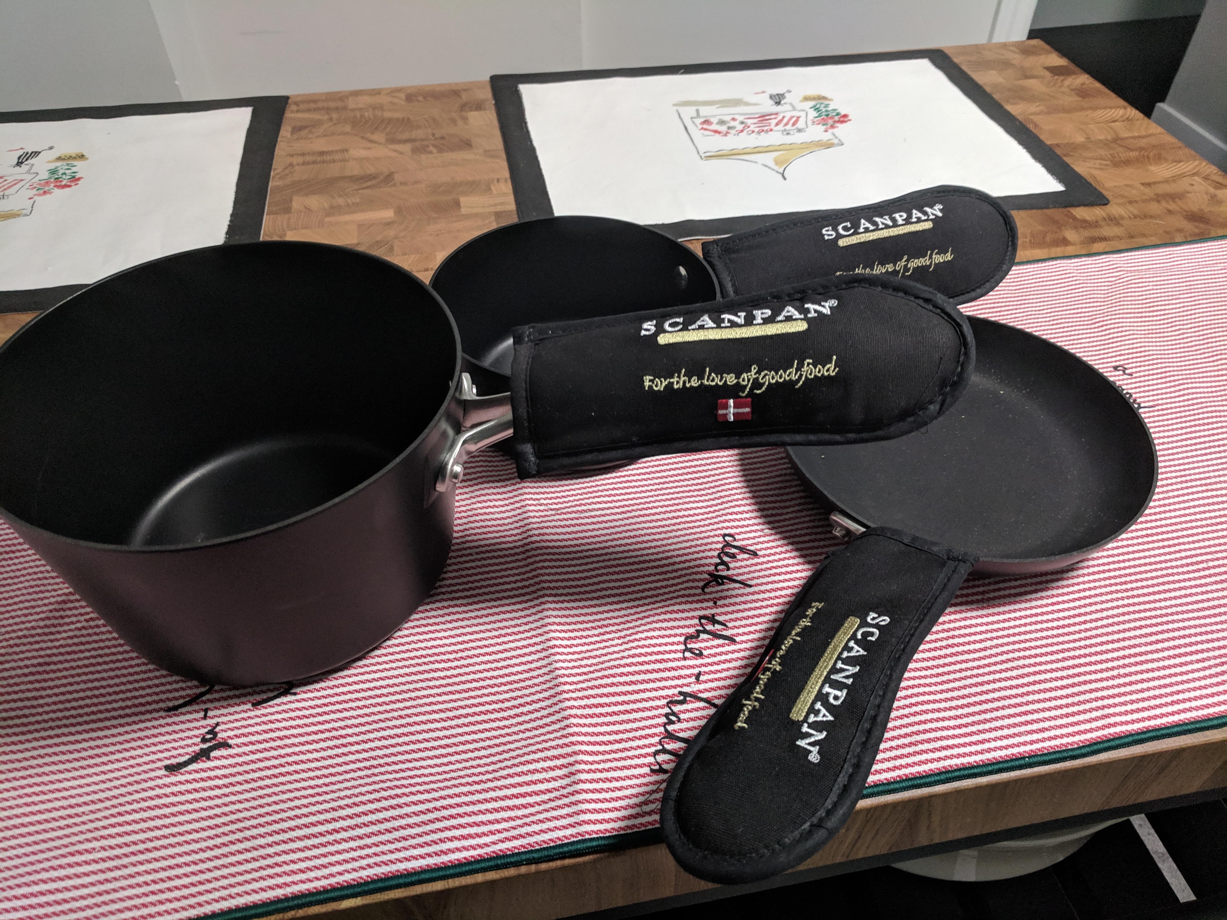 Why does my pots and pans set have mittens? r/pics