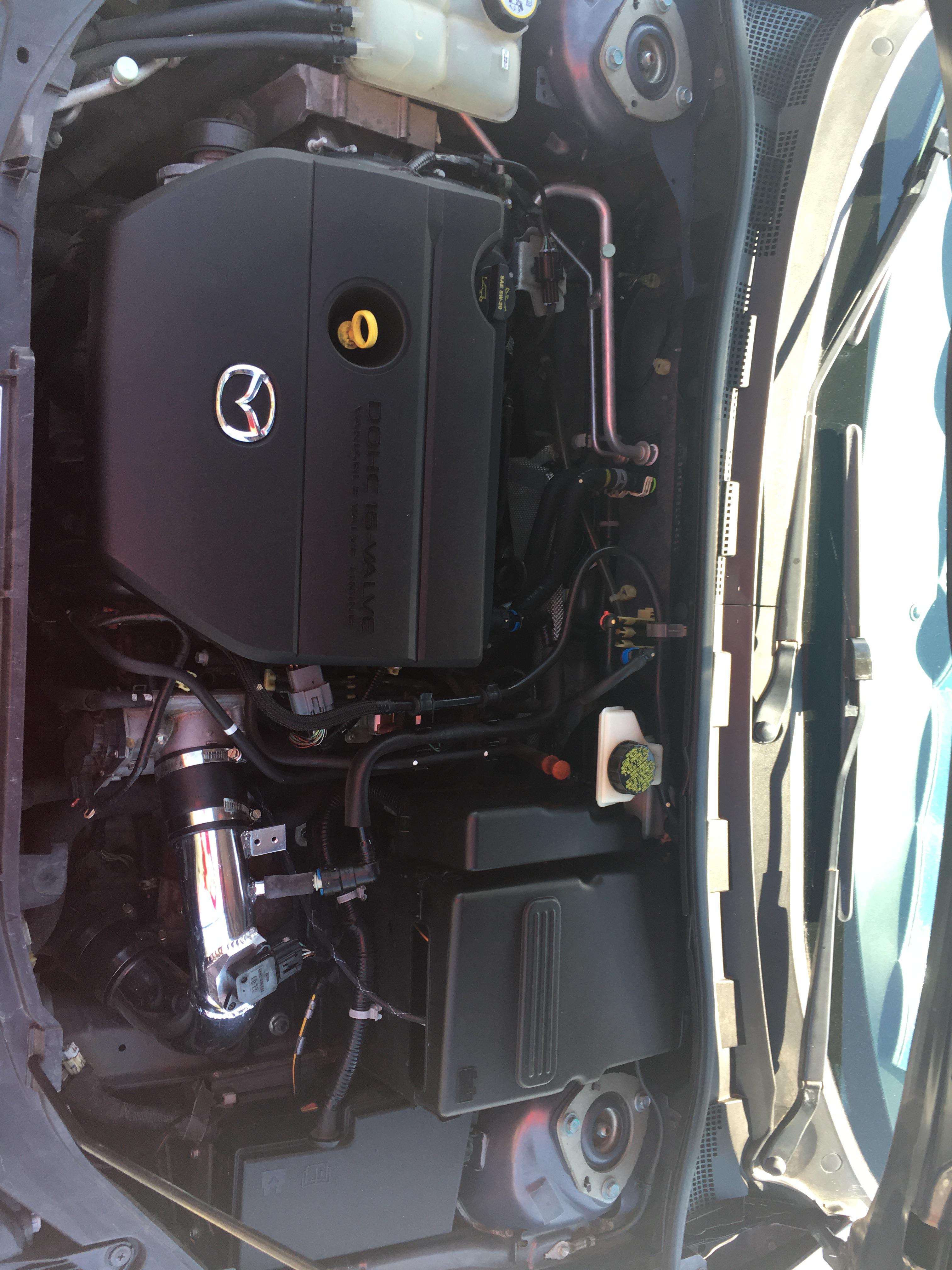 FOLLOWUP 2008 Mazda 3 engine bay. You can see the cold air intake on