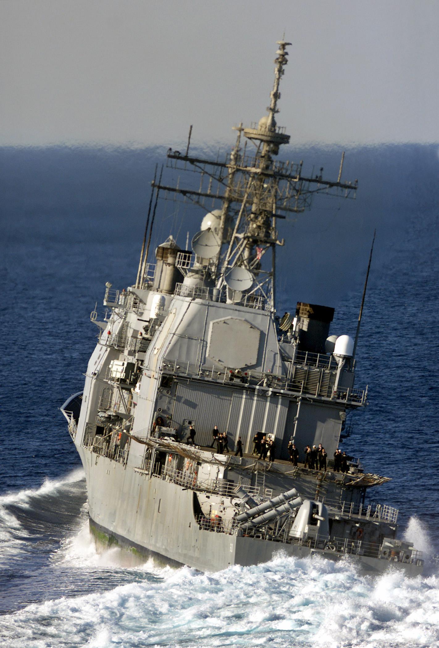 Ticonderogaclass guidedmissile cruiser USS NORMANDY (CG 60) leans