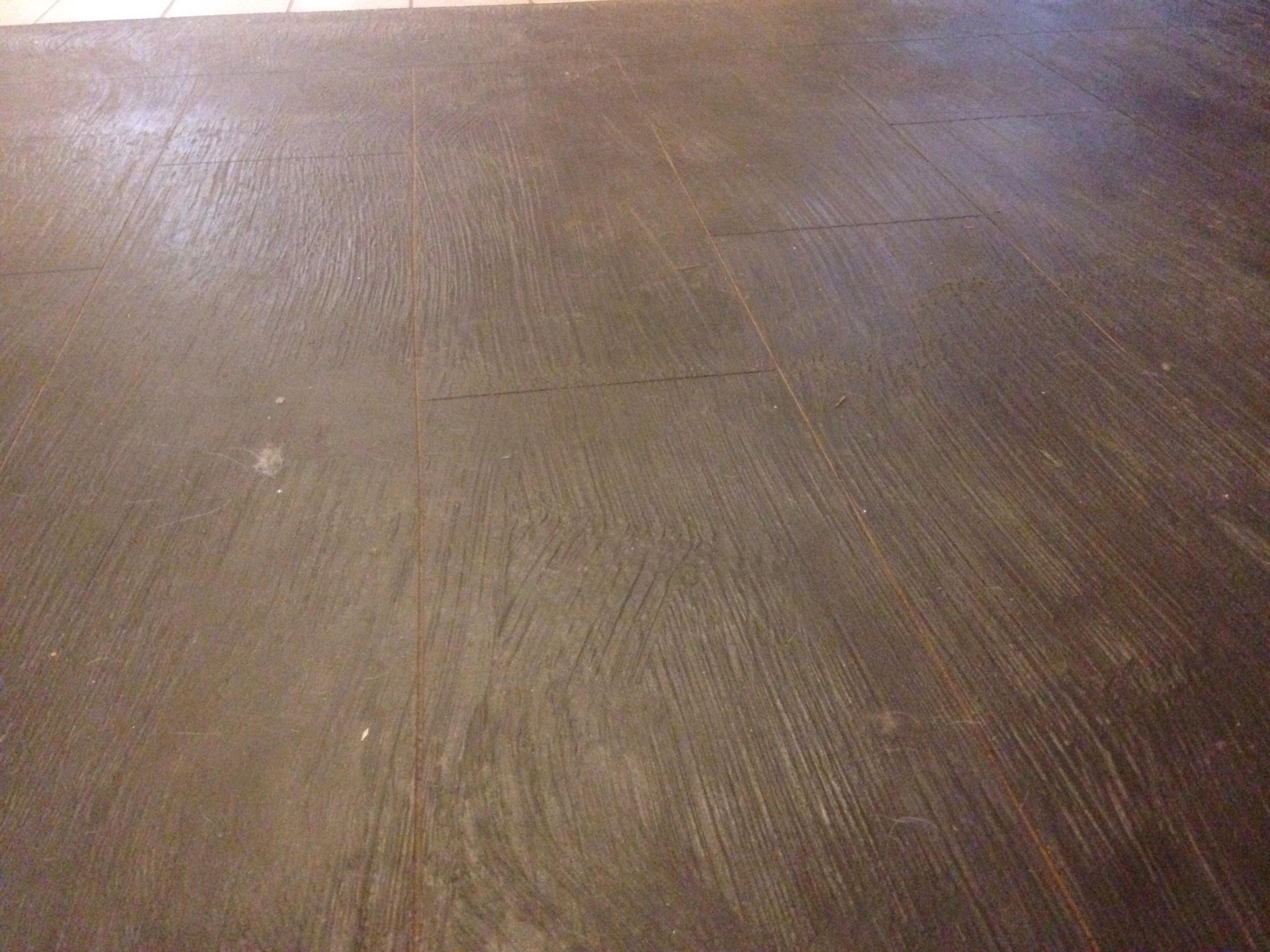 How do I clean this weird textured concrete floor? The grooves catch dirt that doesn't go away