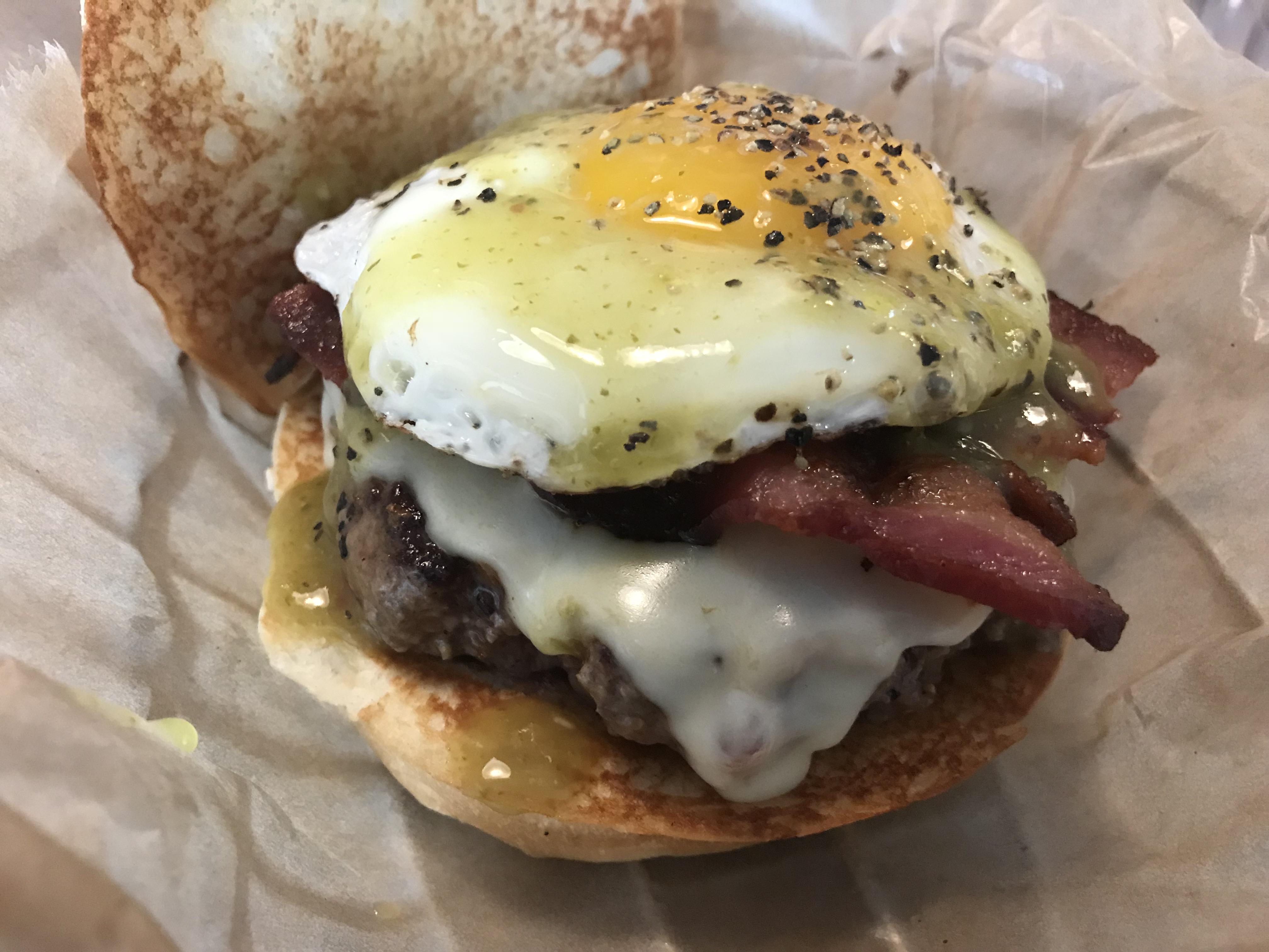 [i ate] a pepper jack cheese burger with bacon and a fried egg at Farm