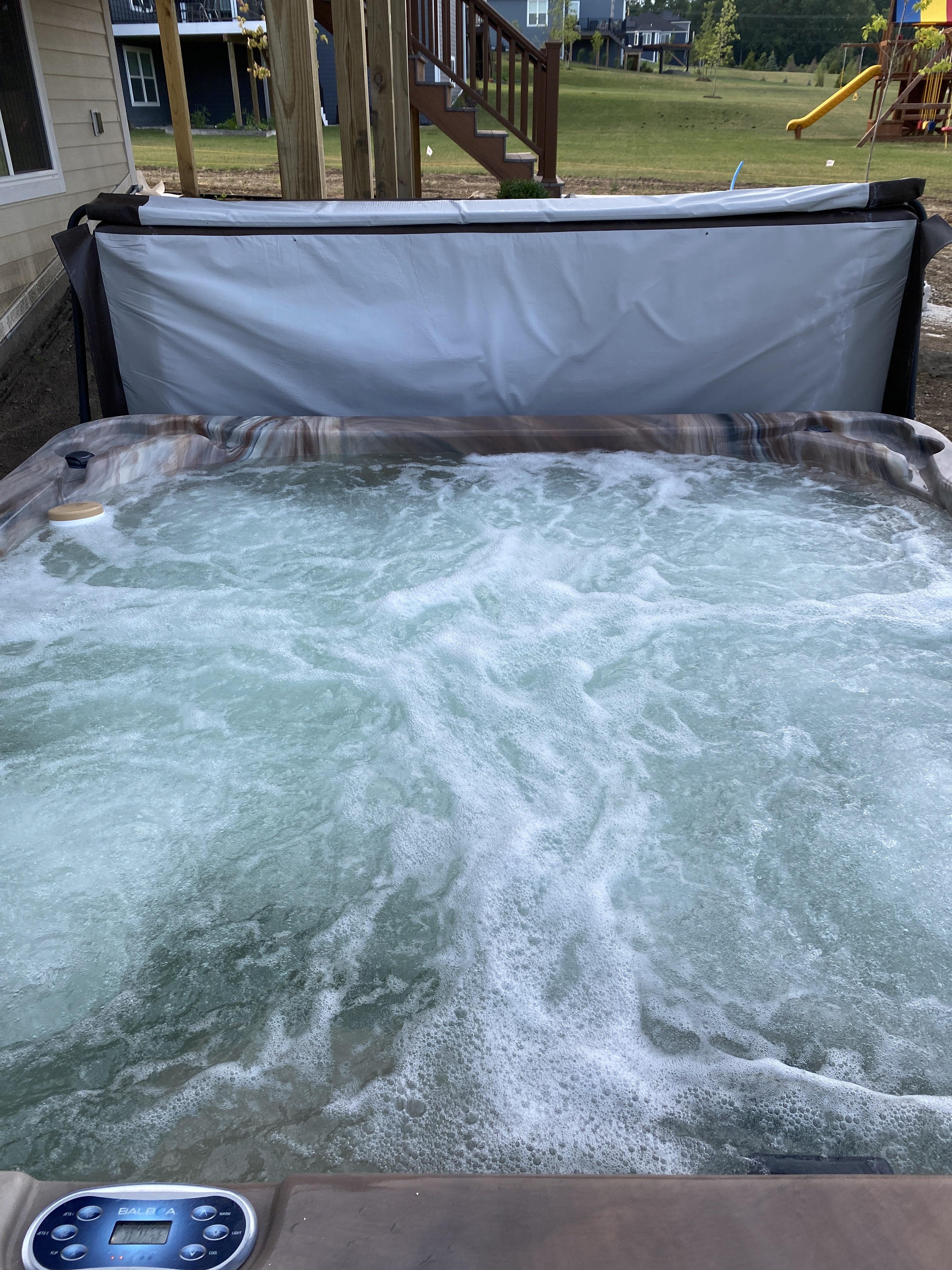 Hot tub water turns green temporarily after chlorine shock. Copper