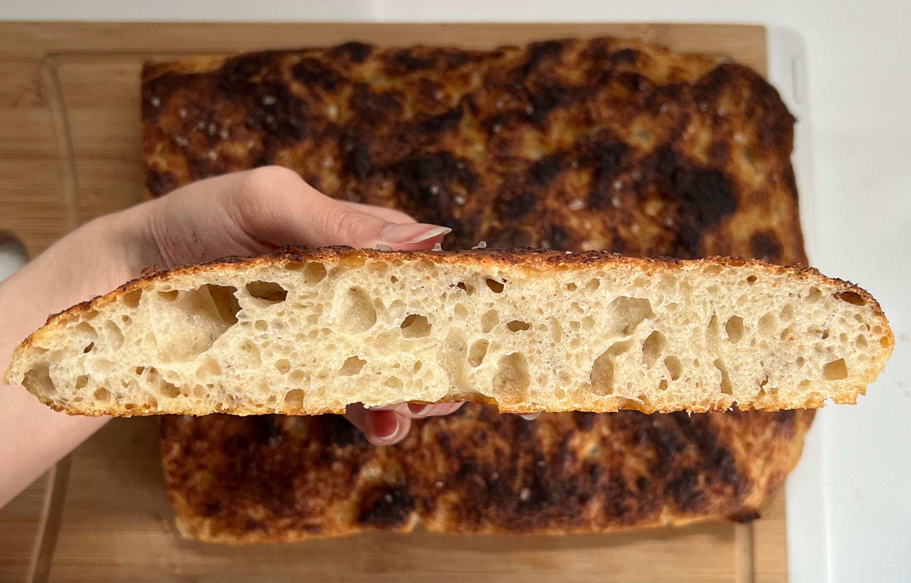 Unexpectedly pleased! Shaping my boule went terribly wrong so I turned it into focaccia instead