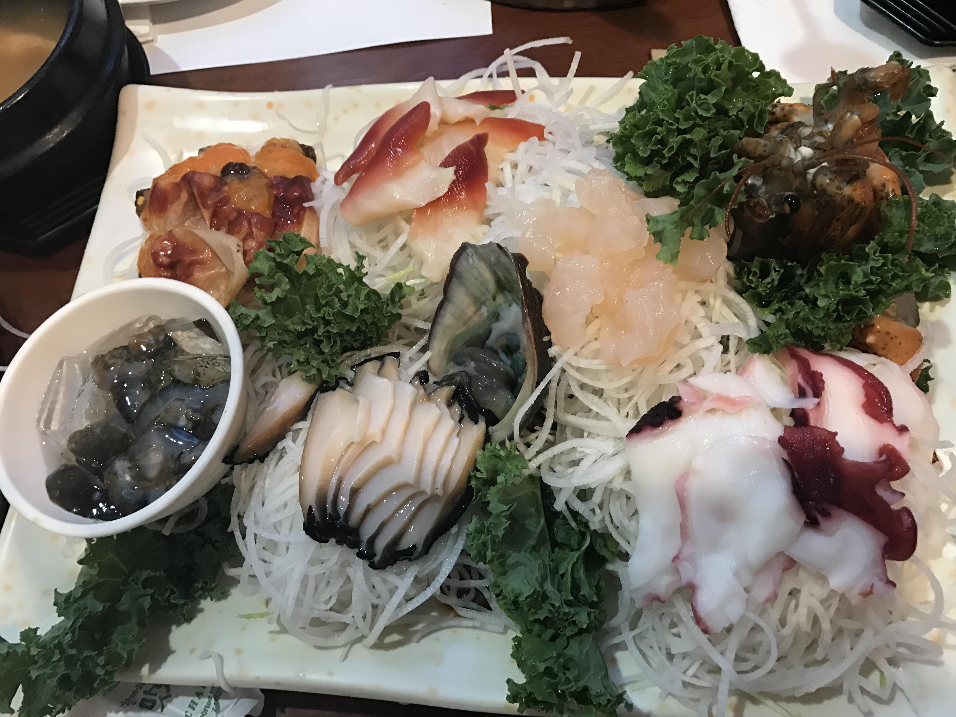 Delicious assortment of readytoeat raw seafood (Sashimi). Can you