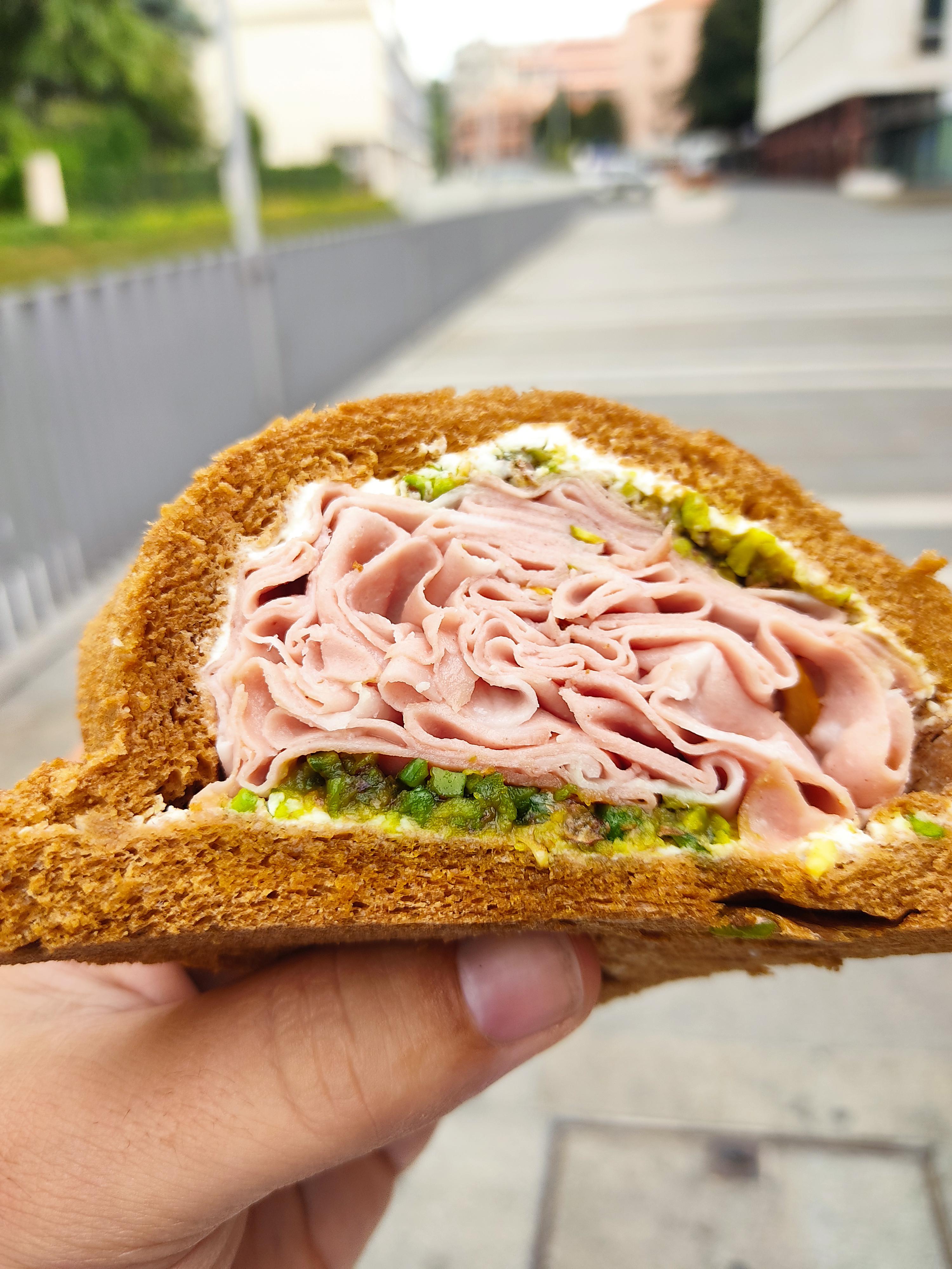 A true Tramezzino from Venice (Italy) mortadella, pistachio sauce, and