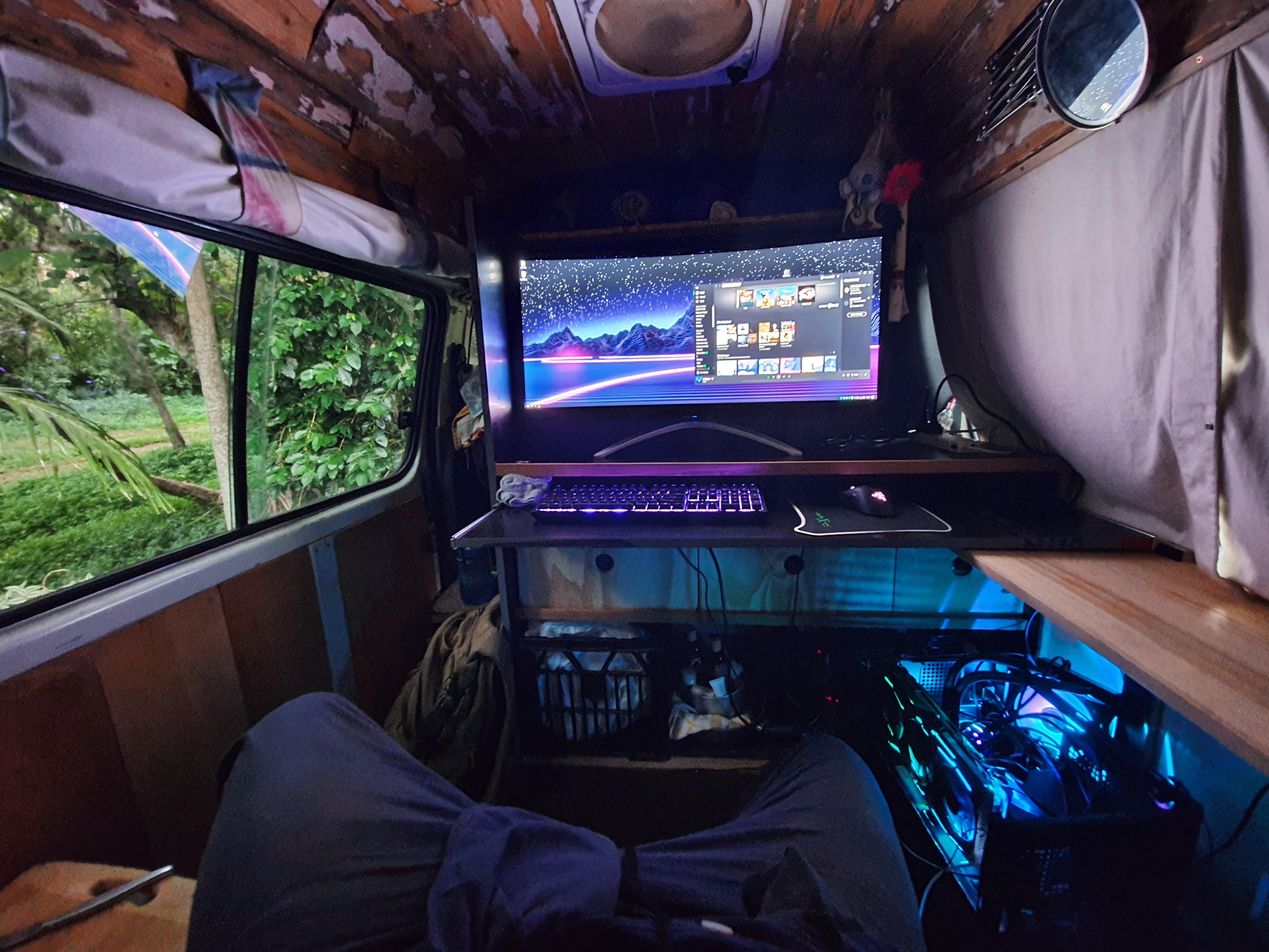 Living in a van doesn't mean you can't have a nice battlestation. r