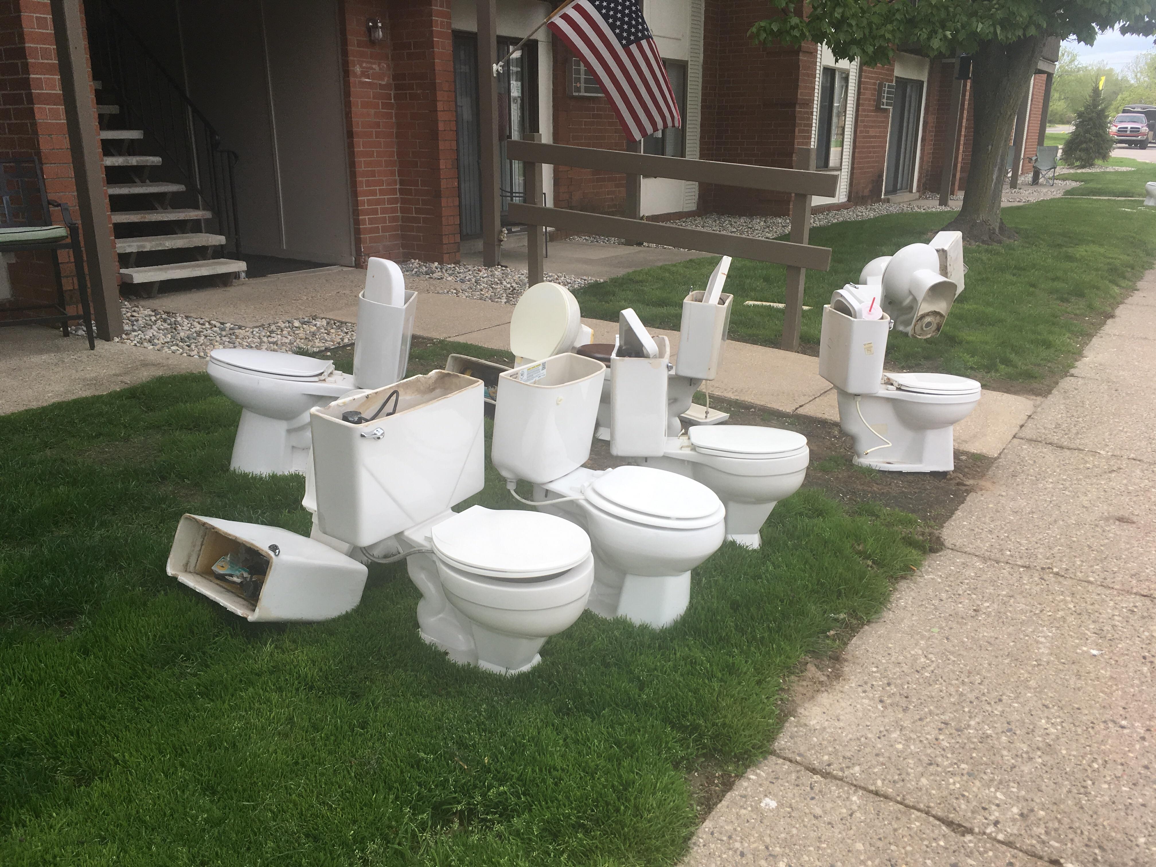 This pile of toilets being replaced with new ones at an apartment