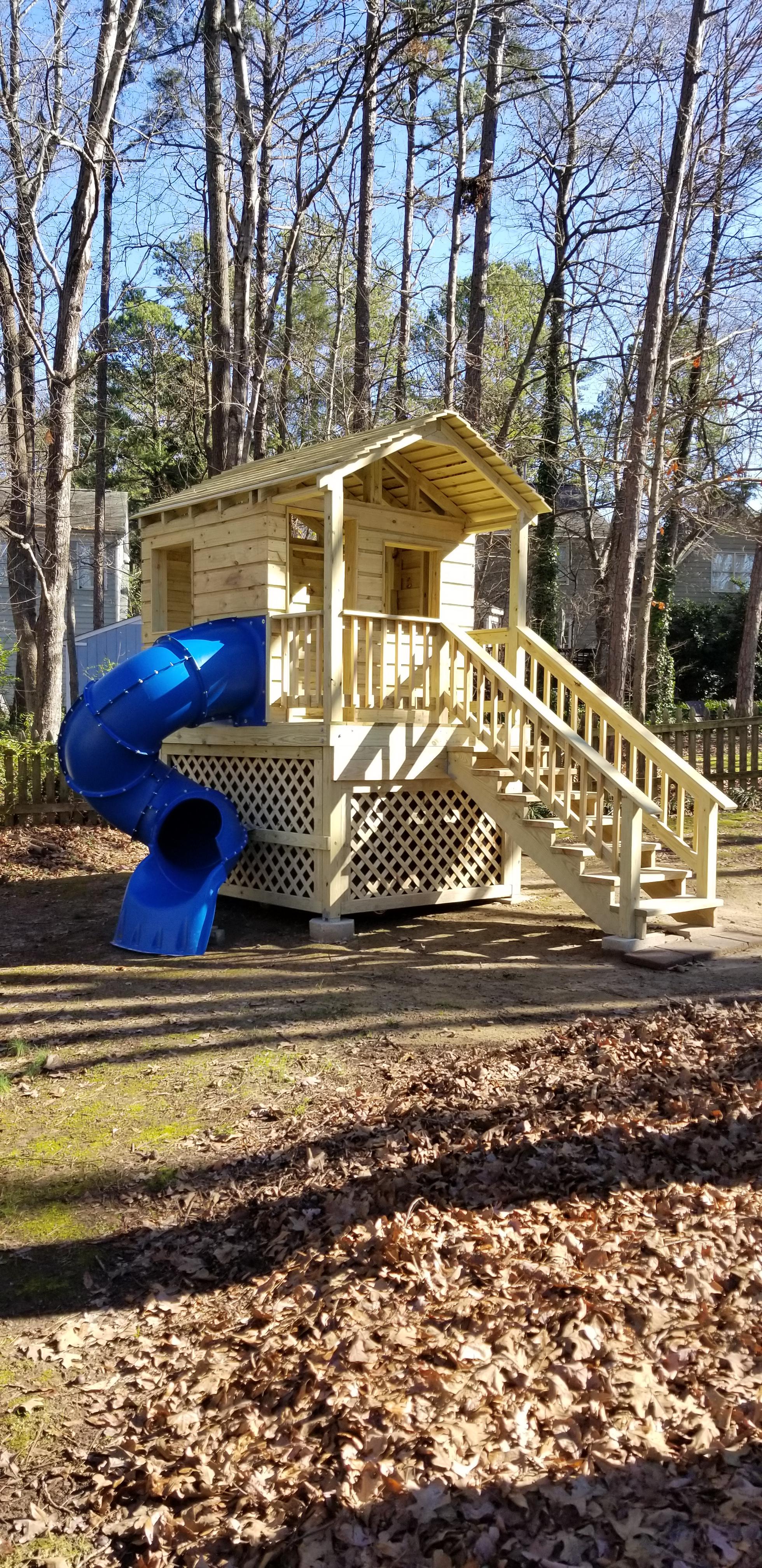 Homemade playhouse I designed and built with my Dad. It even has a