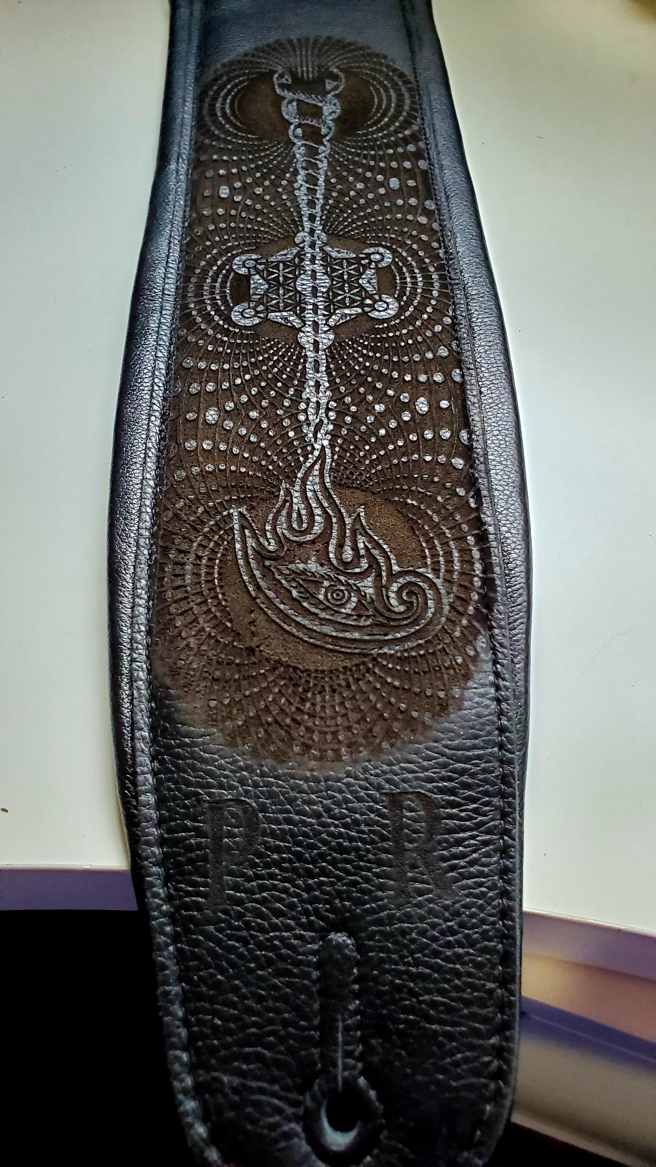 So I had a TOOL inspired custom engraved guitar strap made. I couldn't