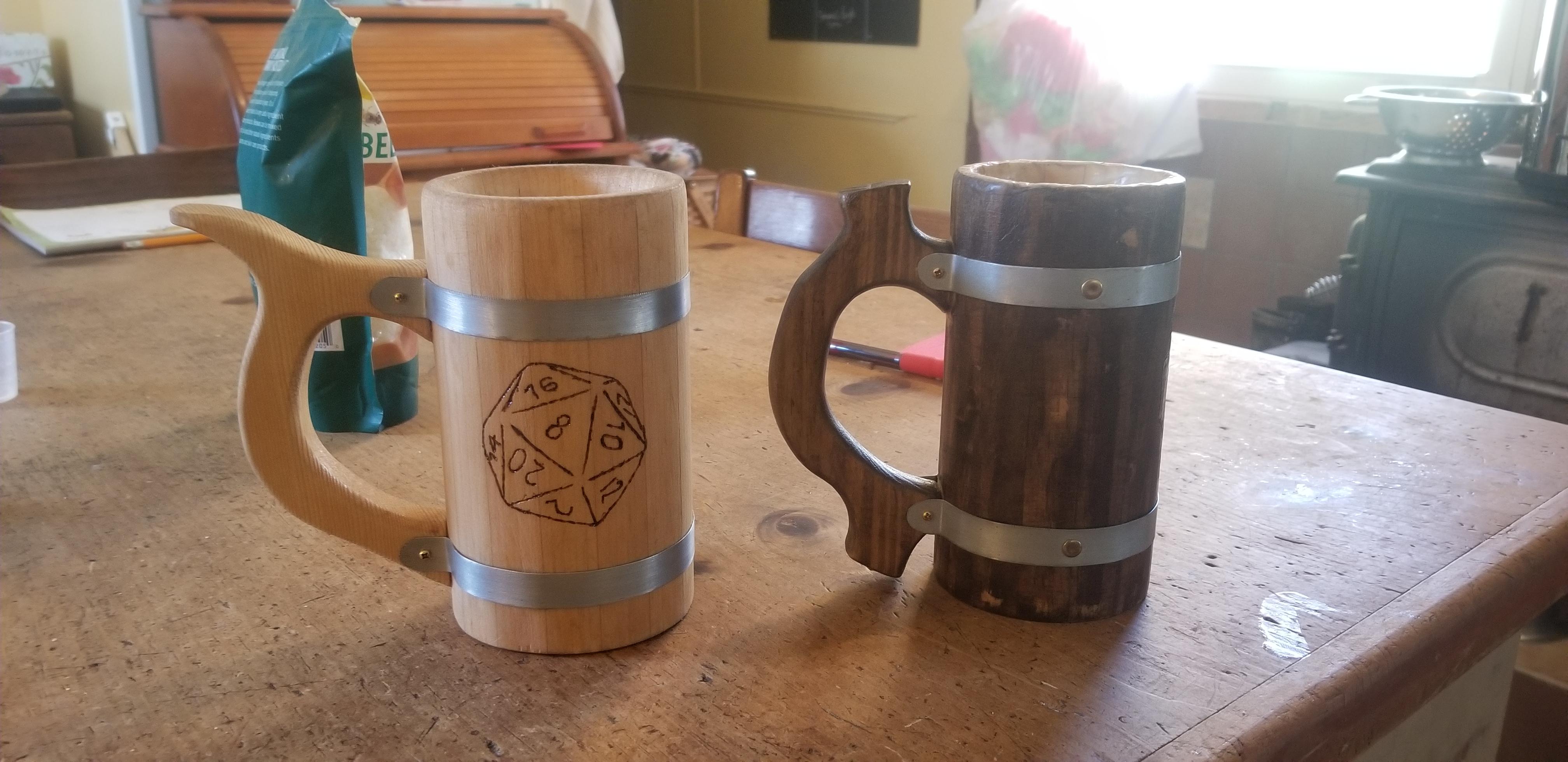 Custom D20 wooden tankards I made over a few weekends. Boards are