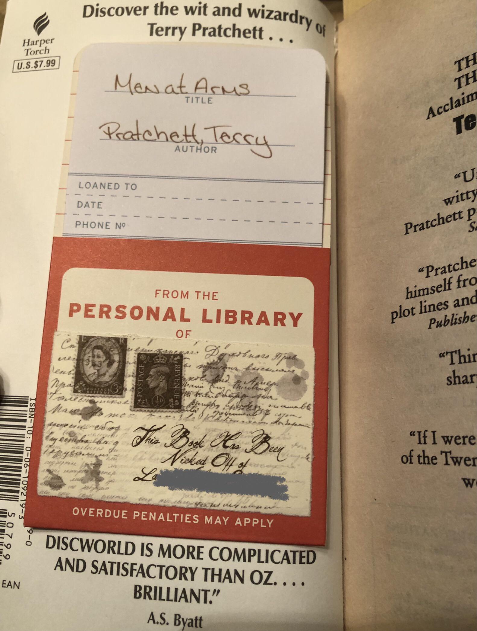 I bought a used book on eBay. It came with a card and pocket on the