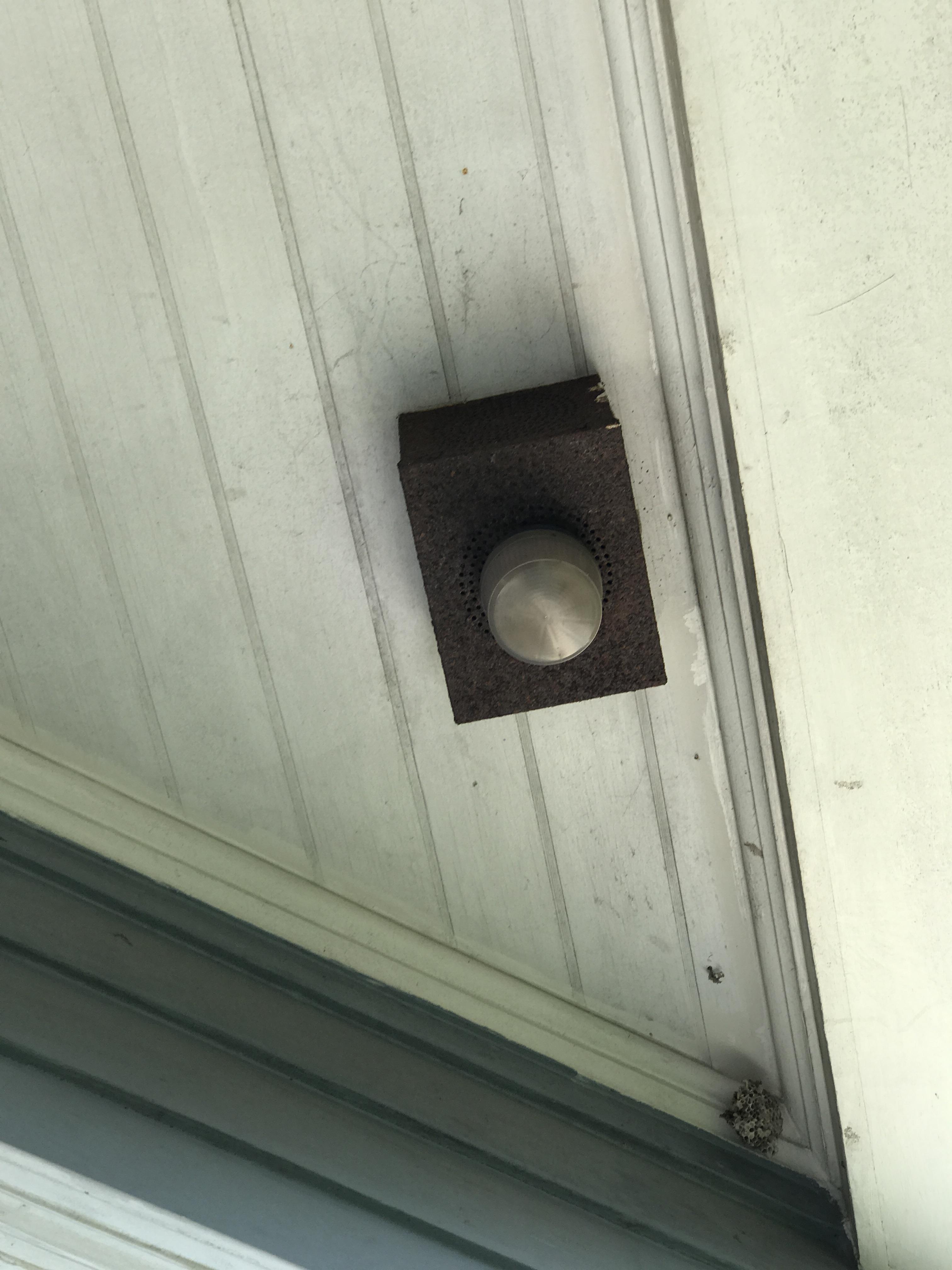 Perforated metal box with glass in the eaves of a very old (100yrs