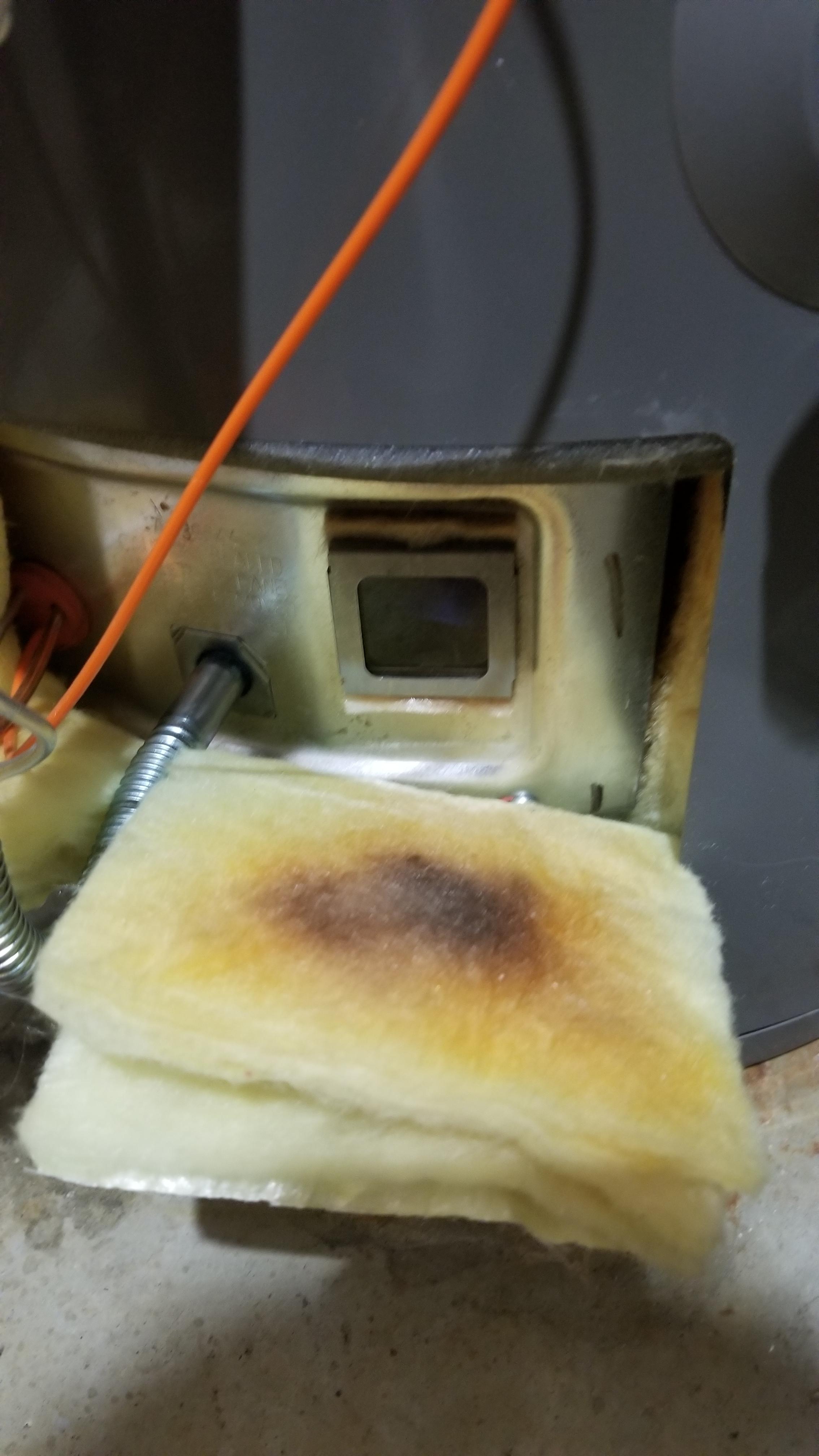 Hot water heater insulation burning r/fixit