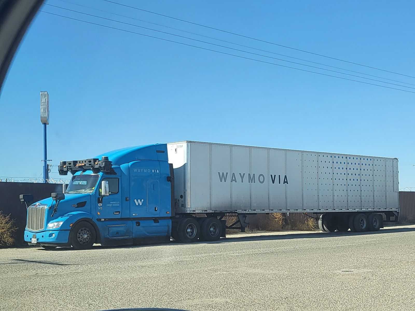This Waymo selfdriving semi truck behind a gas station in El Paso r
