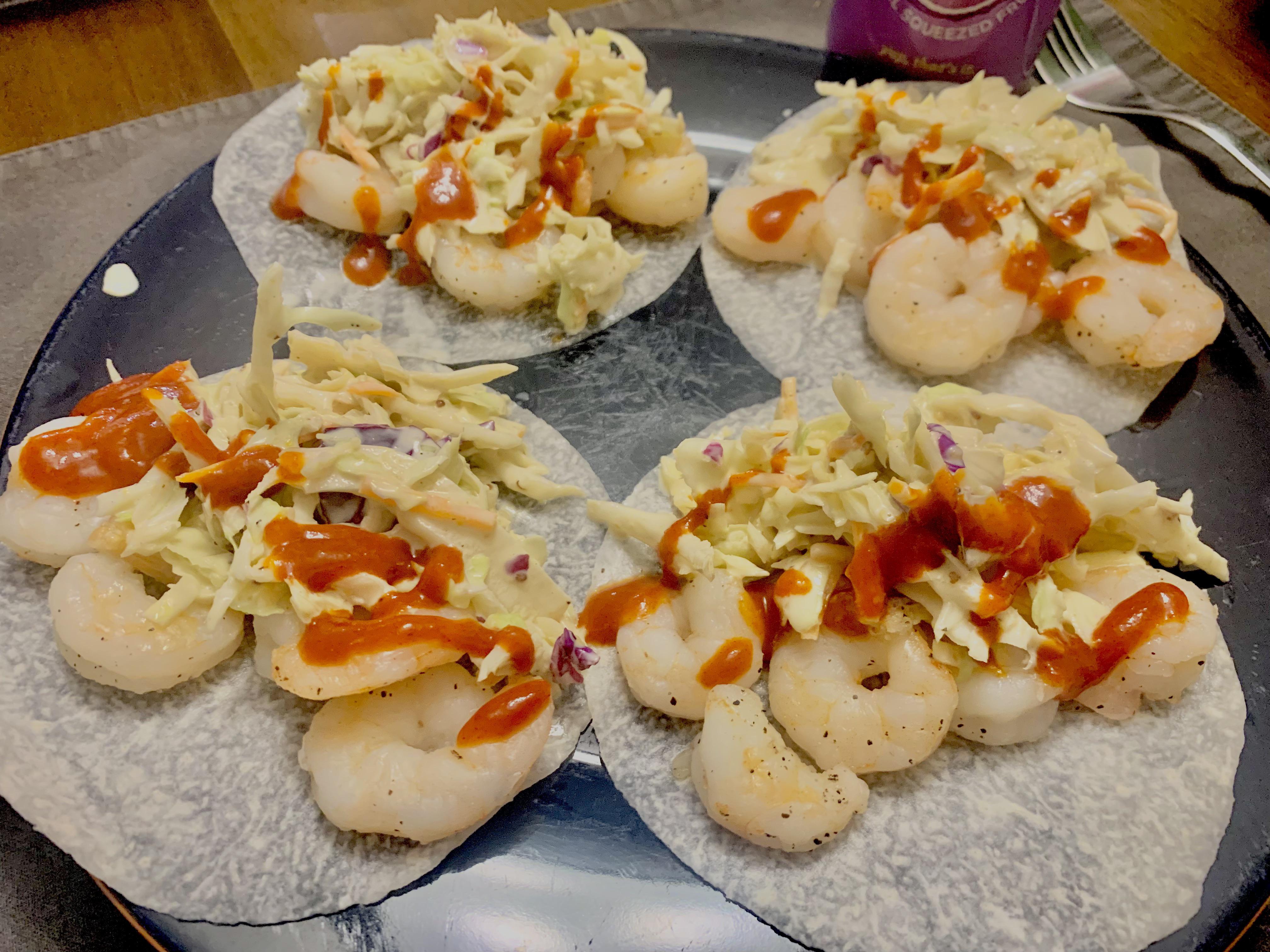 R1D9 Jicama slices with shrimp, a tangy Asian slaw, and yellowbird hot
