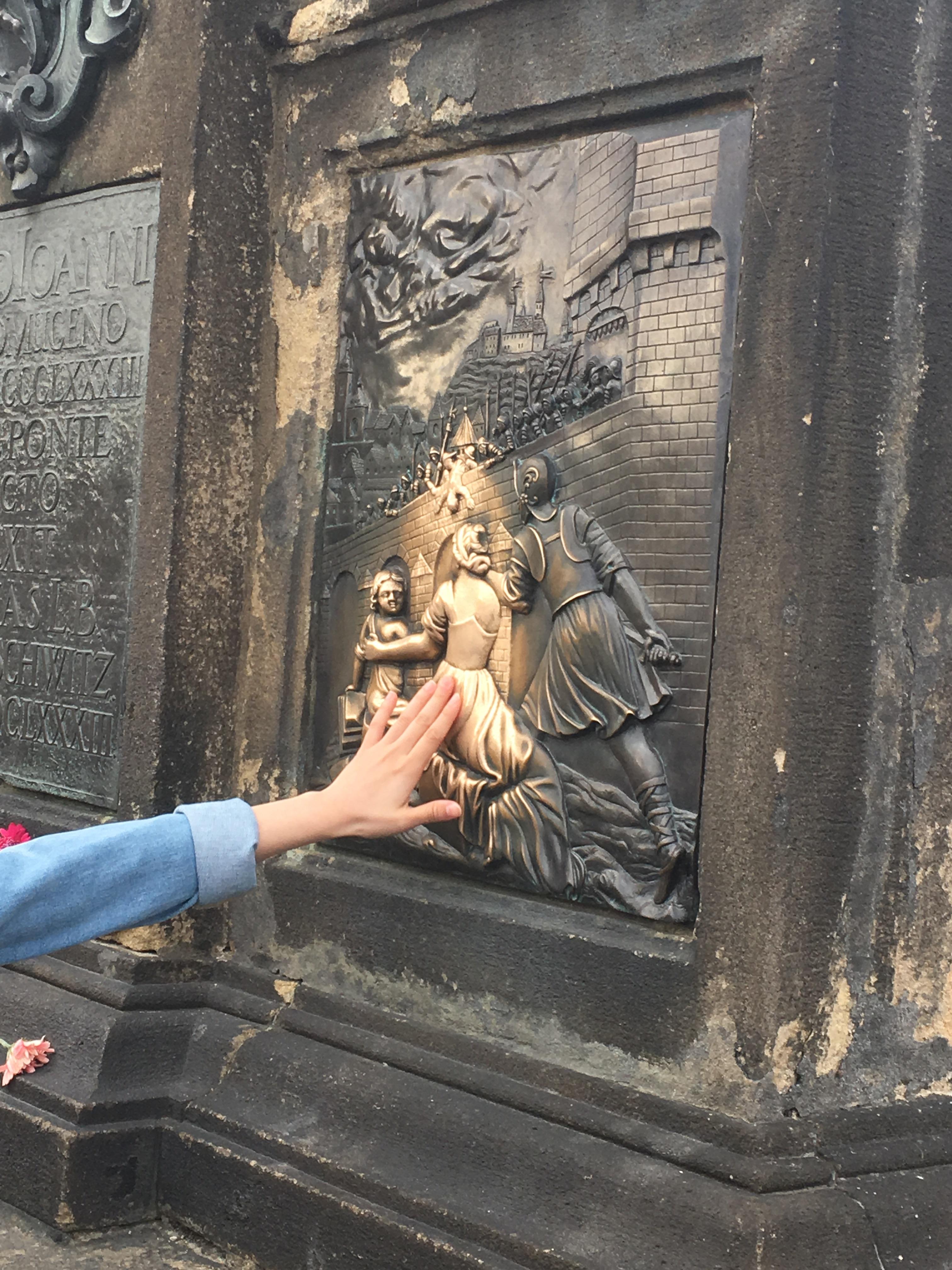 This statue on Charles bridge in Prague has been shined by thousands of