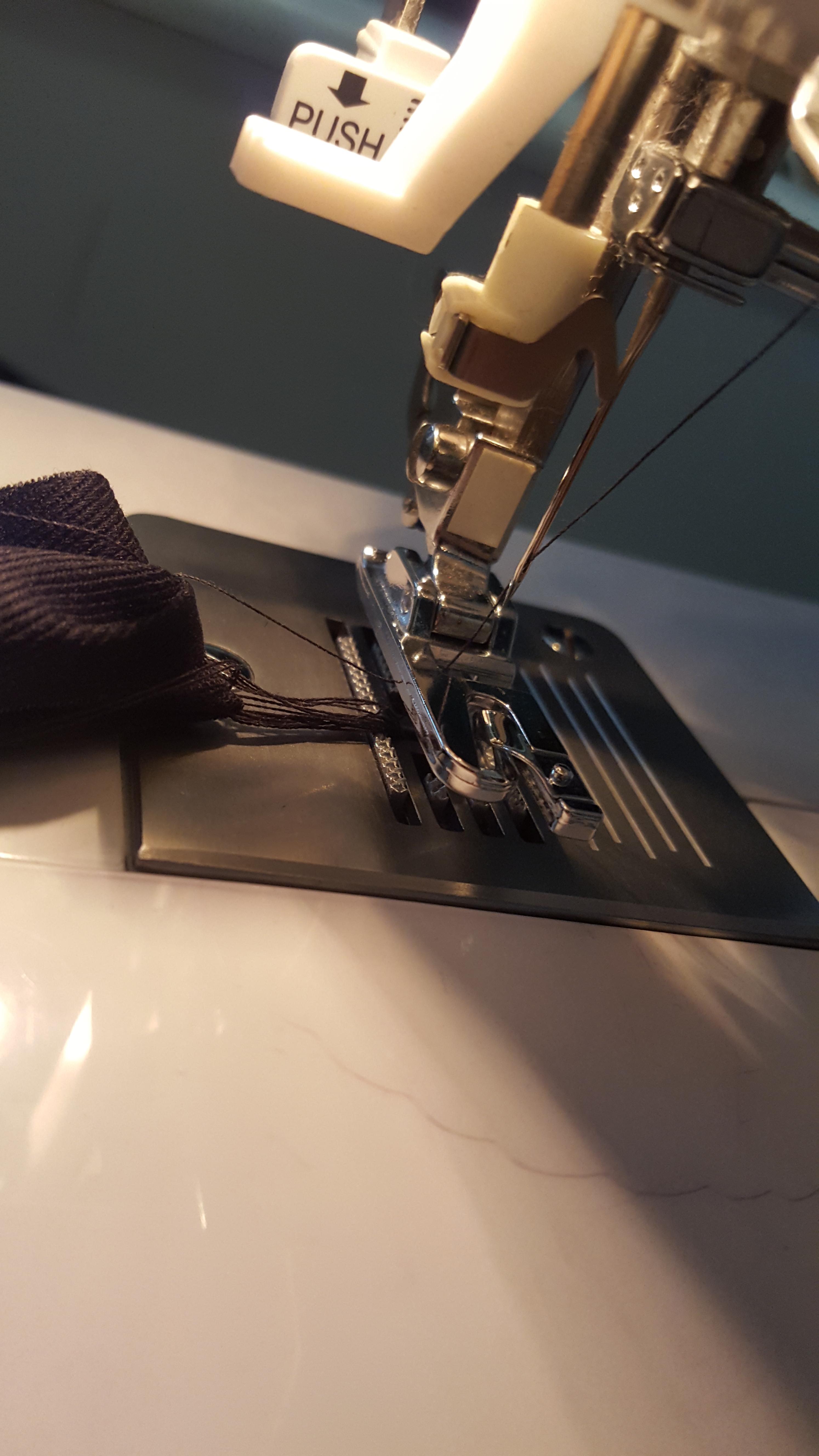 Why is my thread doing this? It wasnt when I was using the same fabric