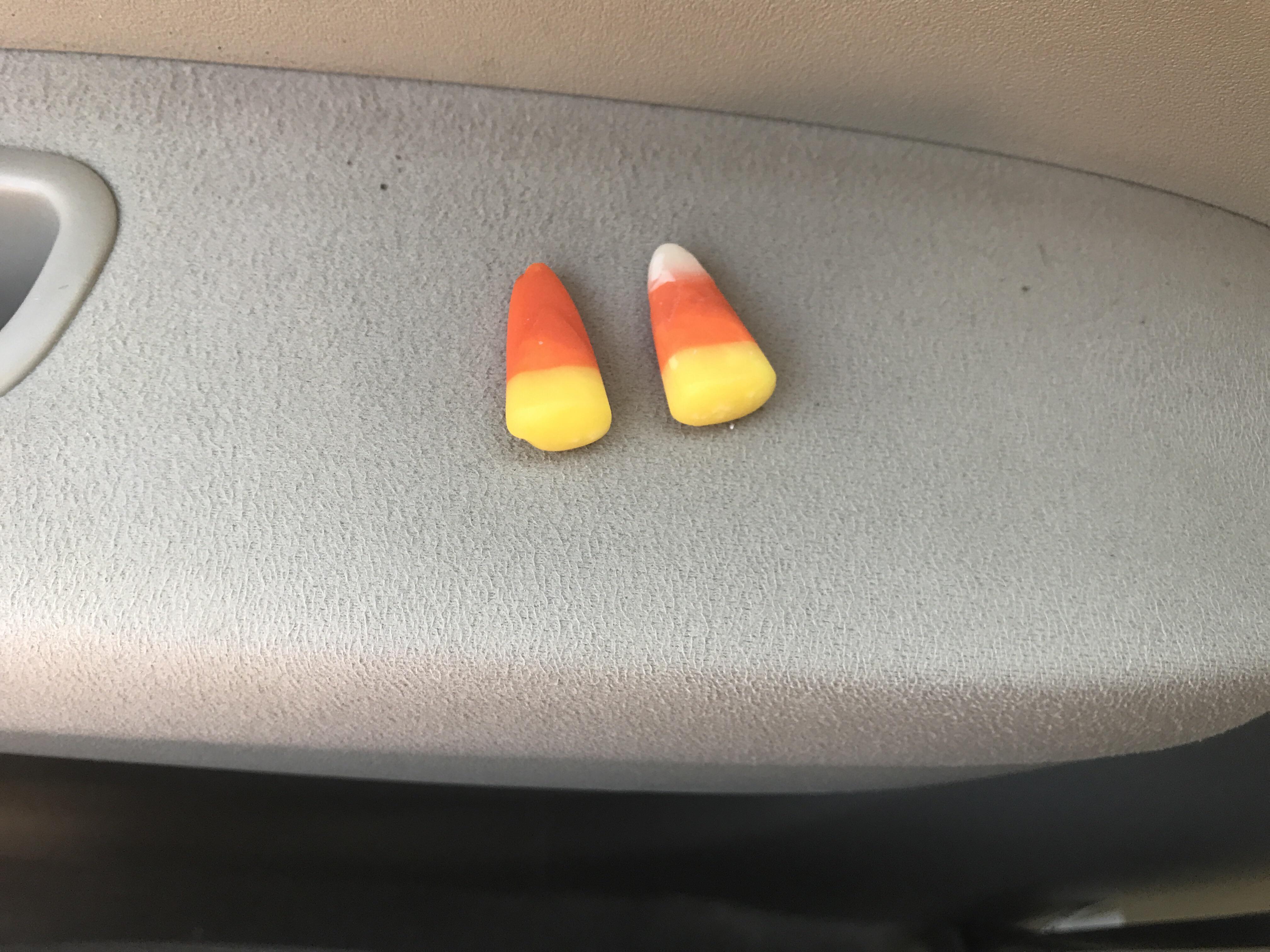 Found a candy corn with no white part (one on right for example of a normal one) r