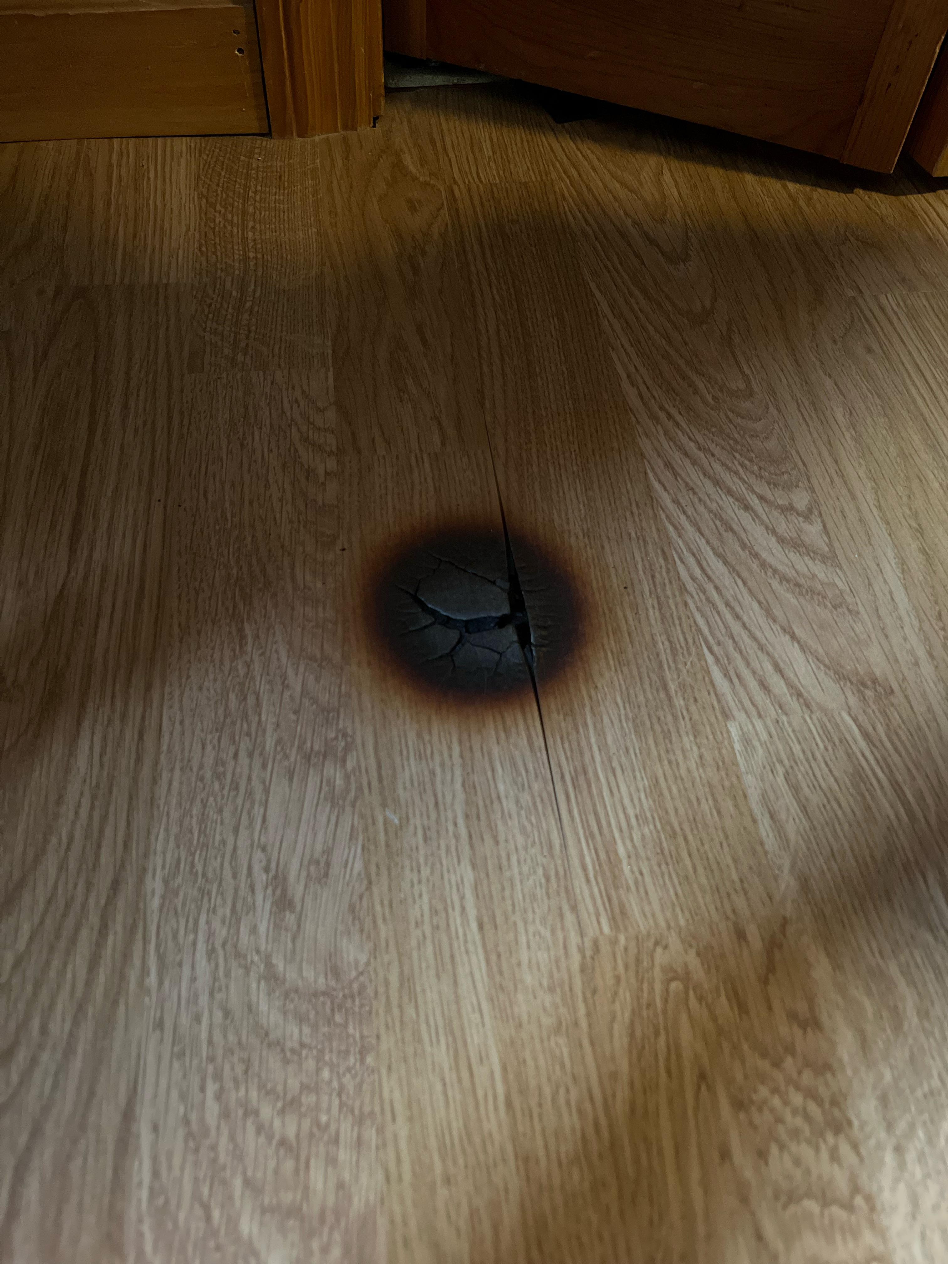 Accidentally left heat lamp on wood floor. How can I fix this? Very