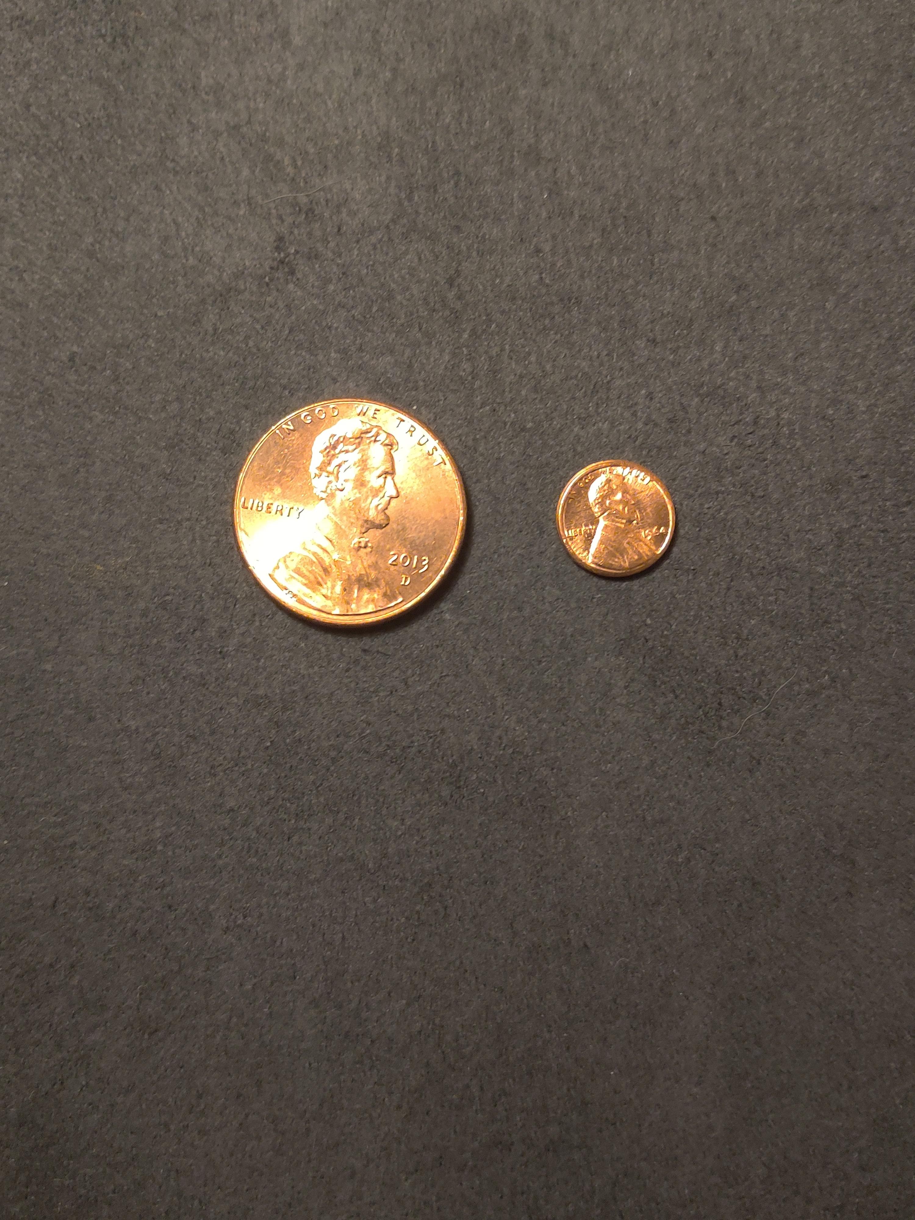 This tiny penny next to a regular penny. r/mildlyinteresting