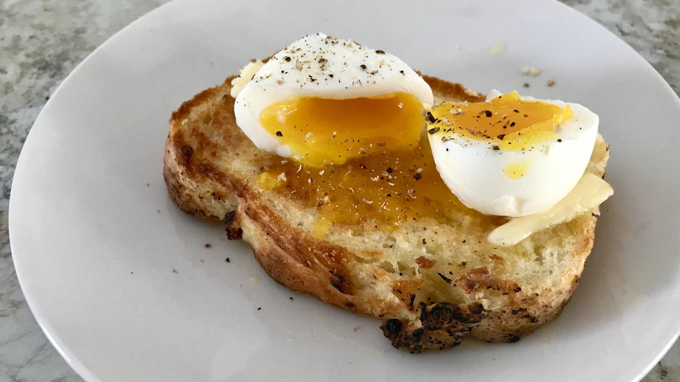 [homemade] soft boiled egg on a homemade bread buttered toast. food