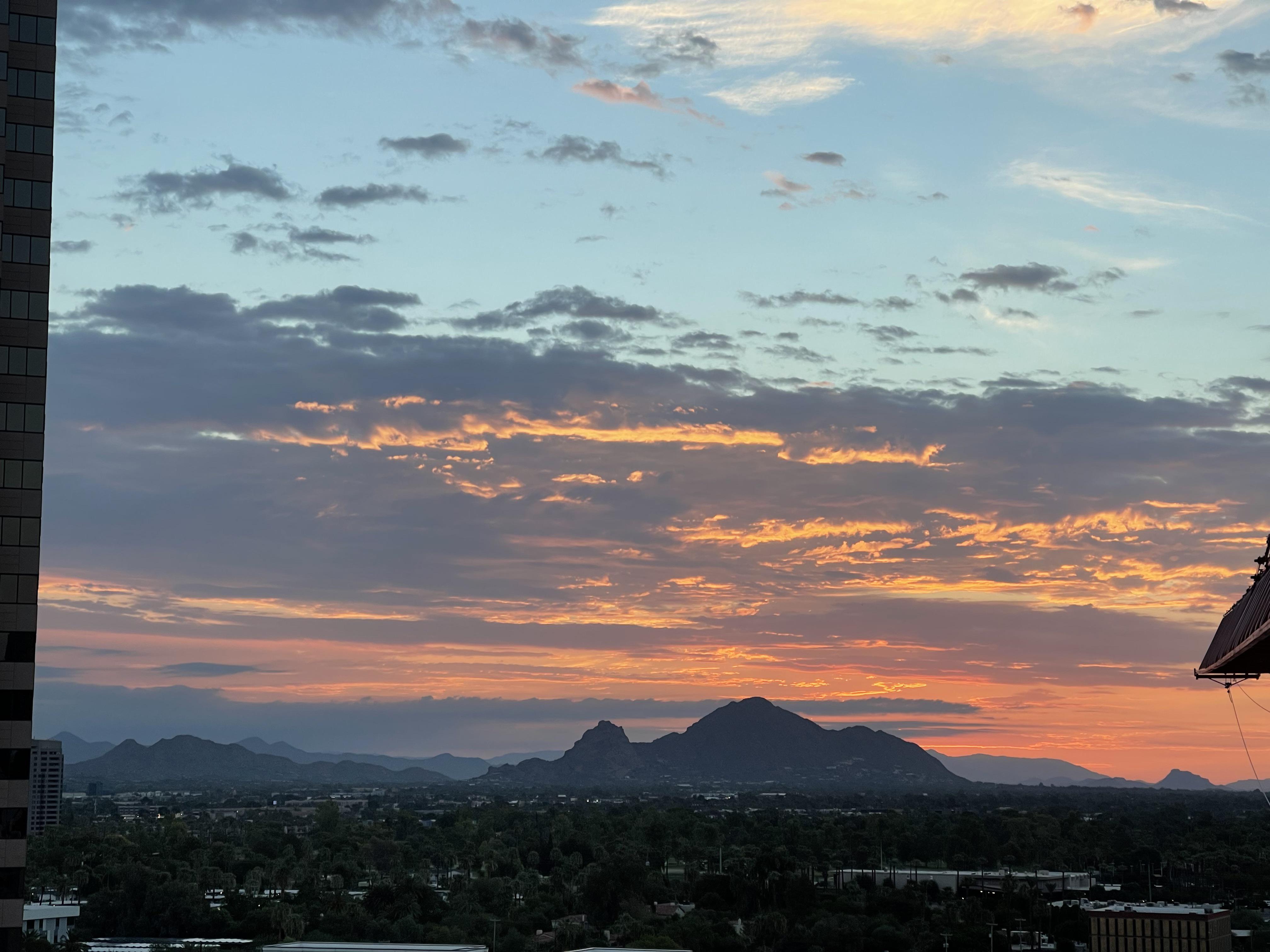 Cloudy sunrise over Camelback mountain. r/arizona
