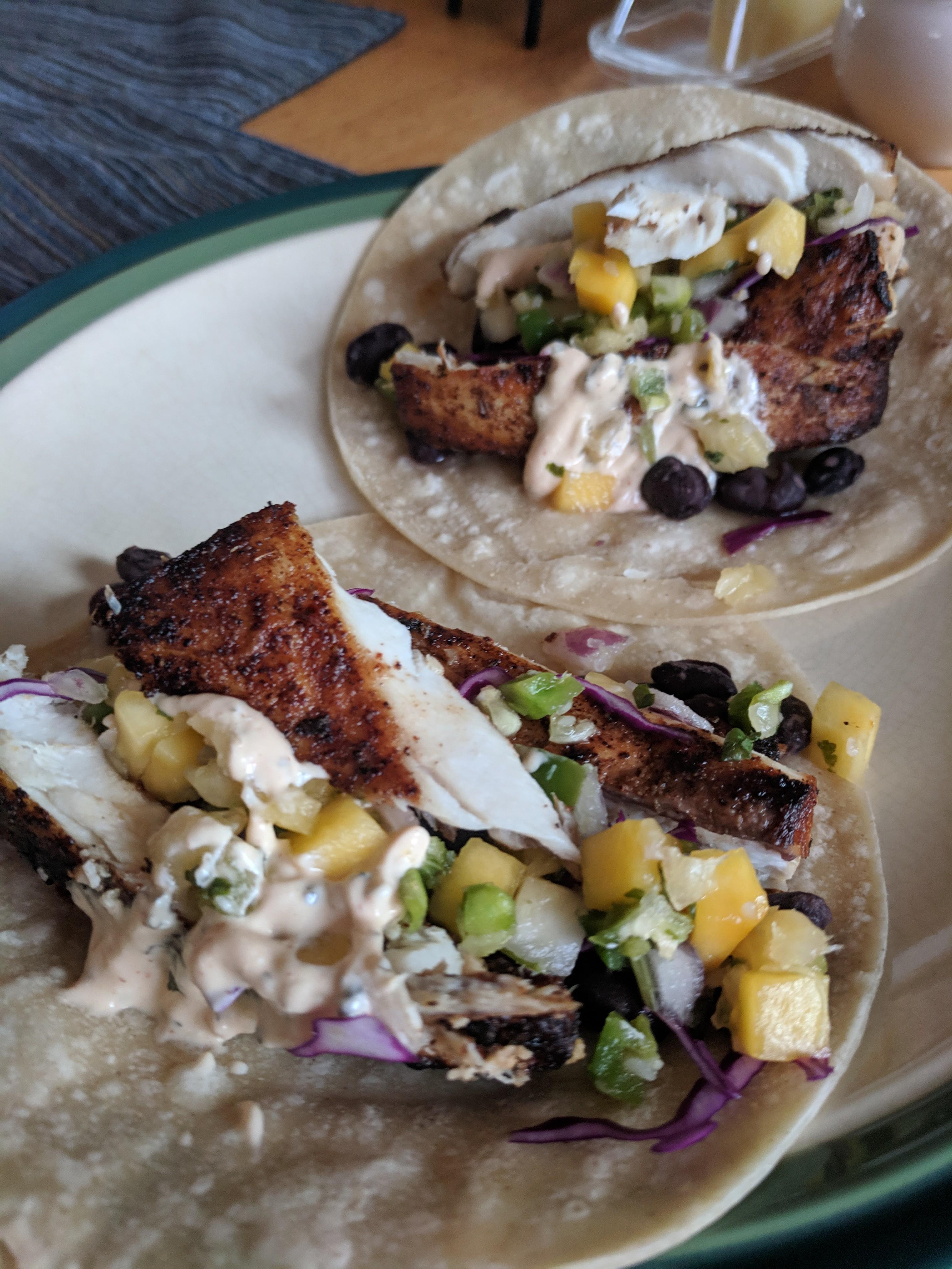 Blackened mahi mahi tacos with yogurt taco sauce, mango pineapple salsa
