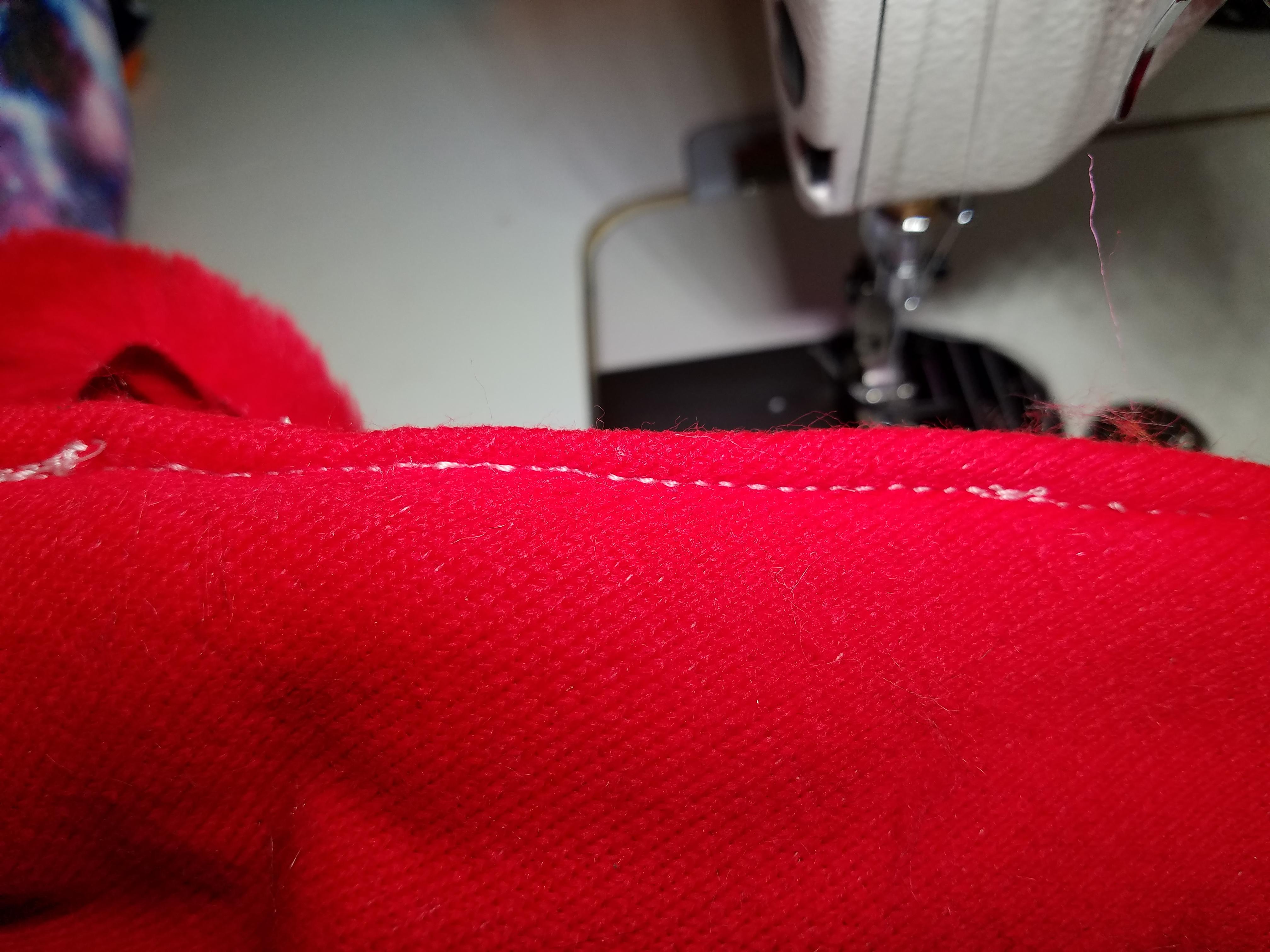 Industrial machine's bottom stitch seems to be skipping or just