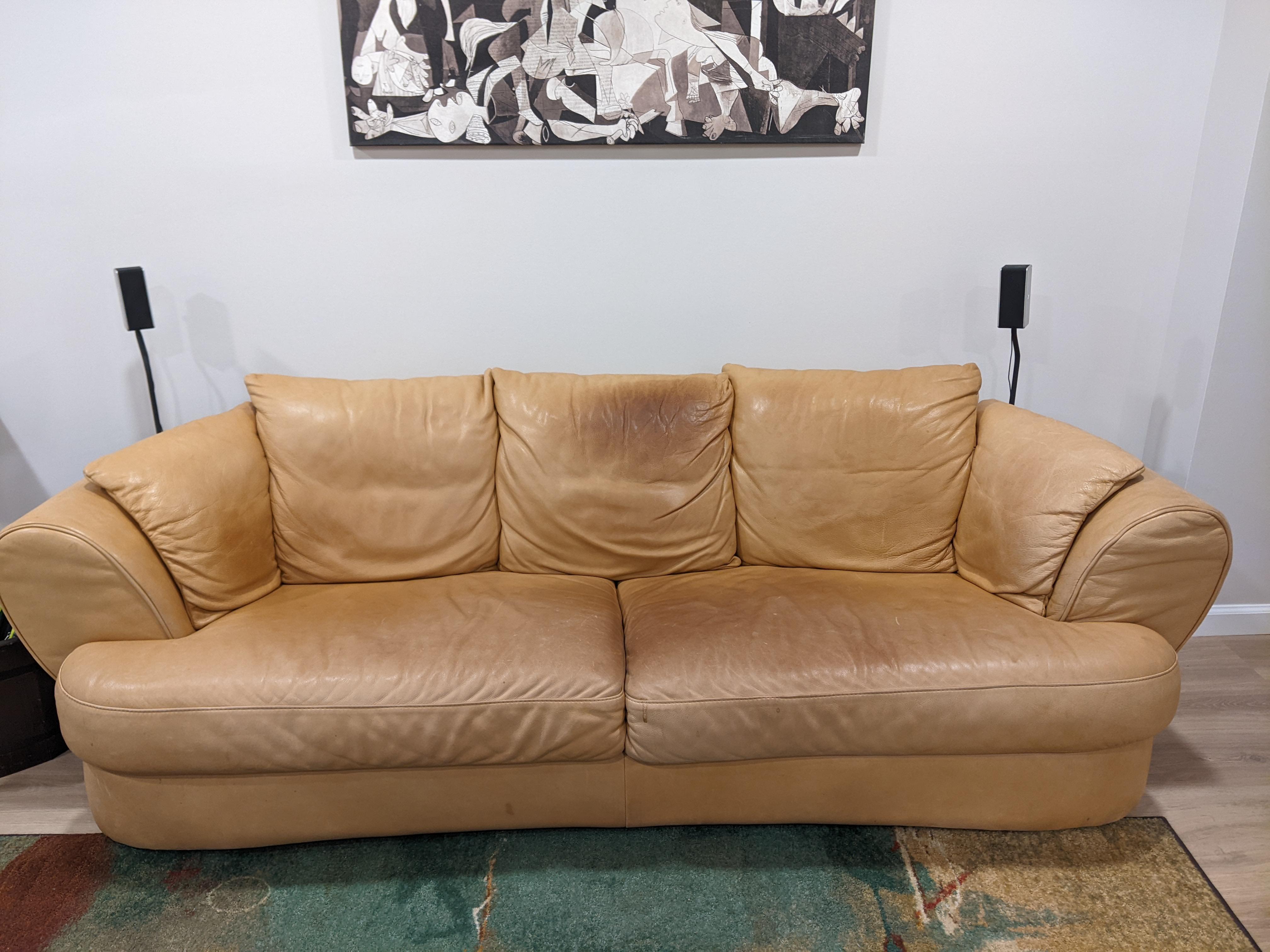 Aniline leather couch stained with body oils can I clean it on my own