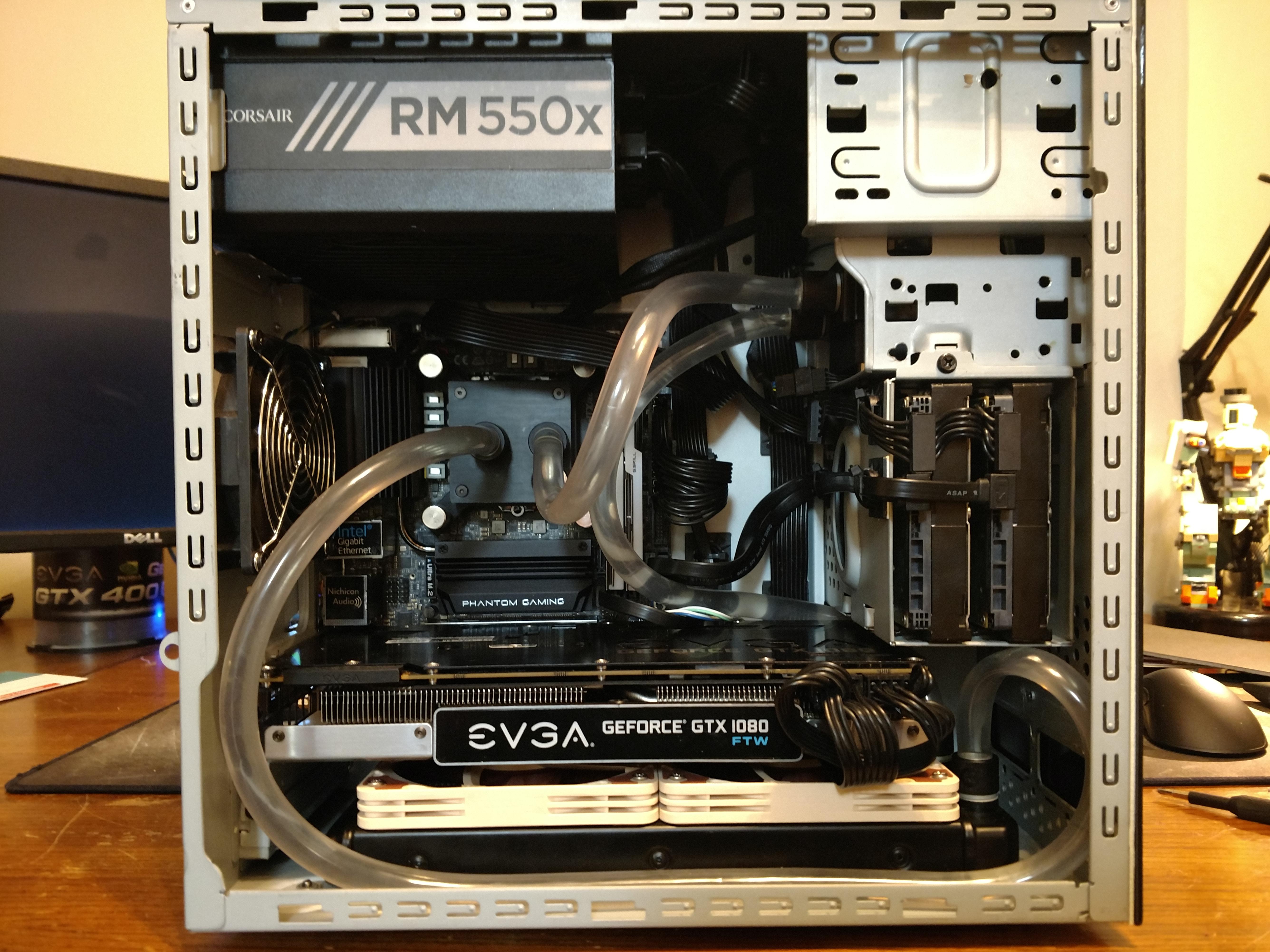 My own water cooled sff made from an old e machines ofc I removed the ugly front panel and made