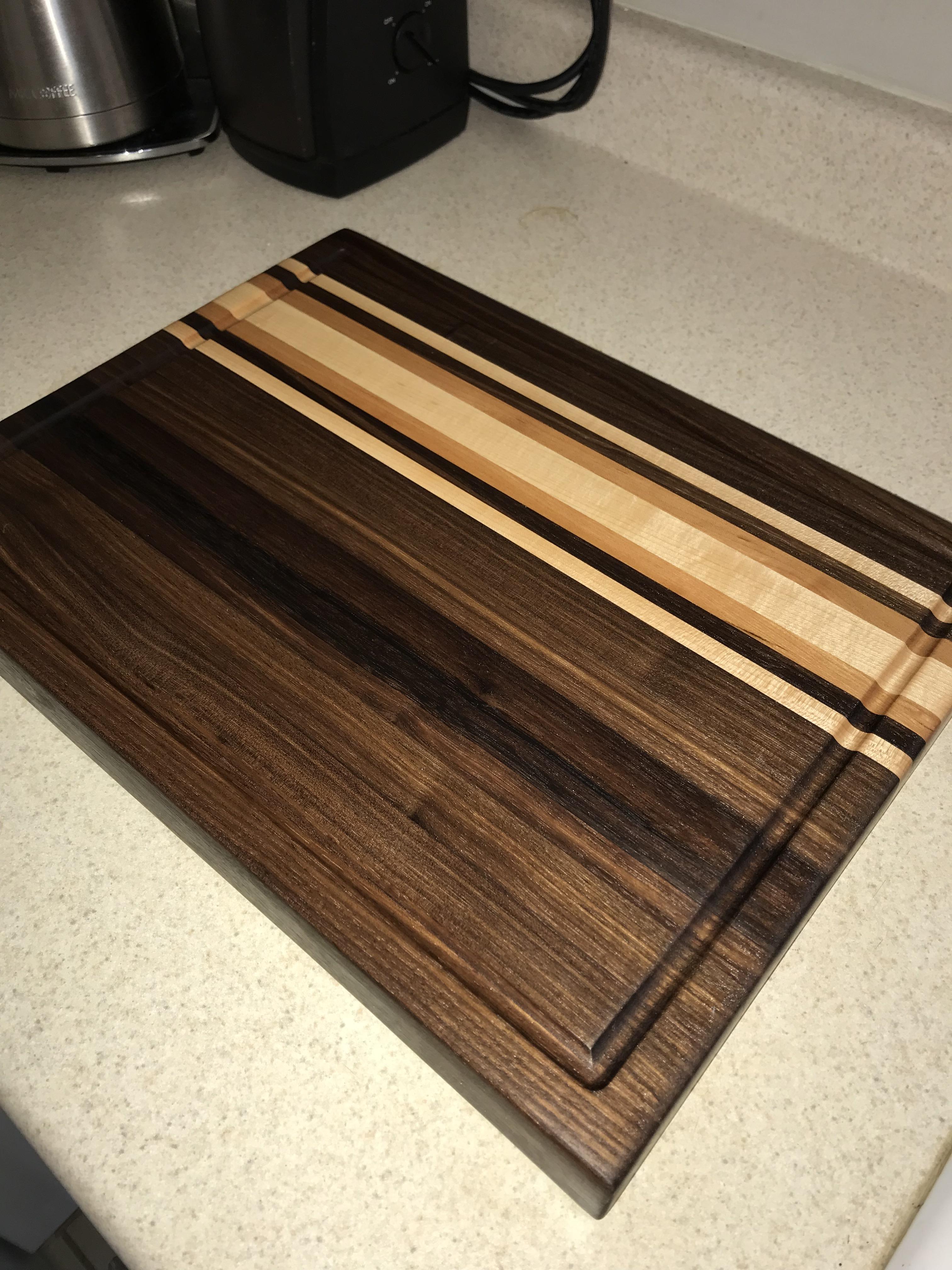 Cutting board made of walnut, maple, and cherry. r/woodworking
