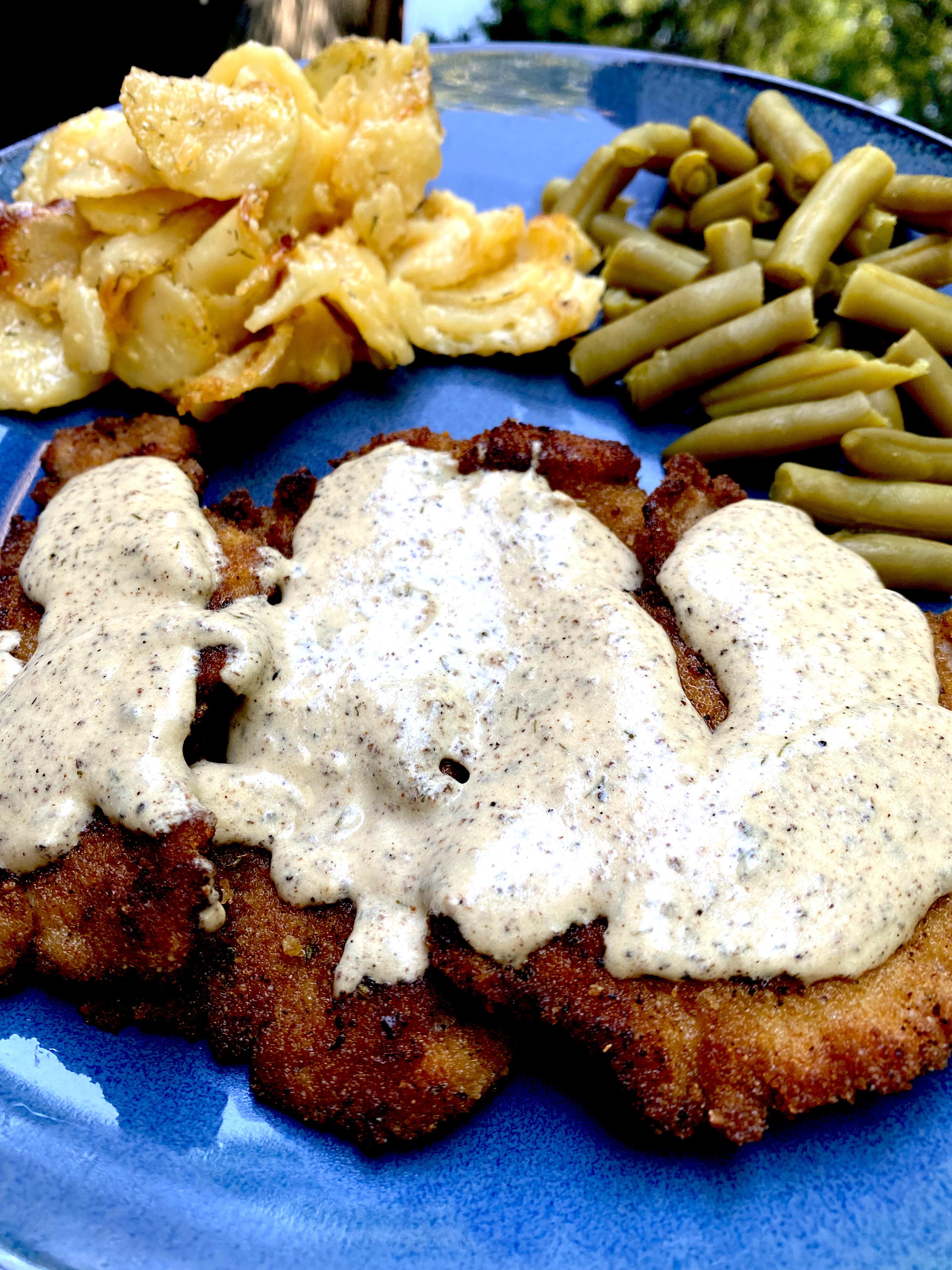 [Homemade] breaded pork tenderloin with a dill cream sauce, scalloped