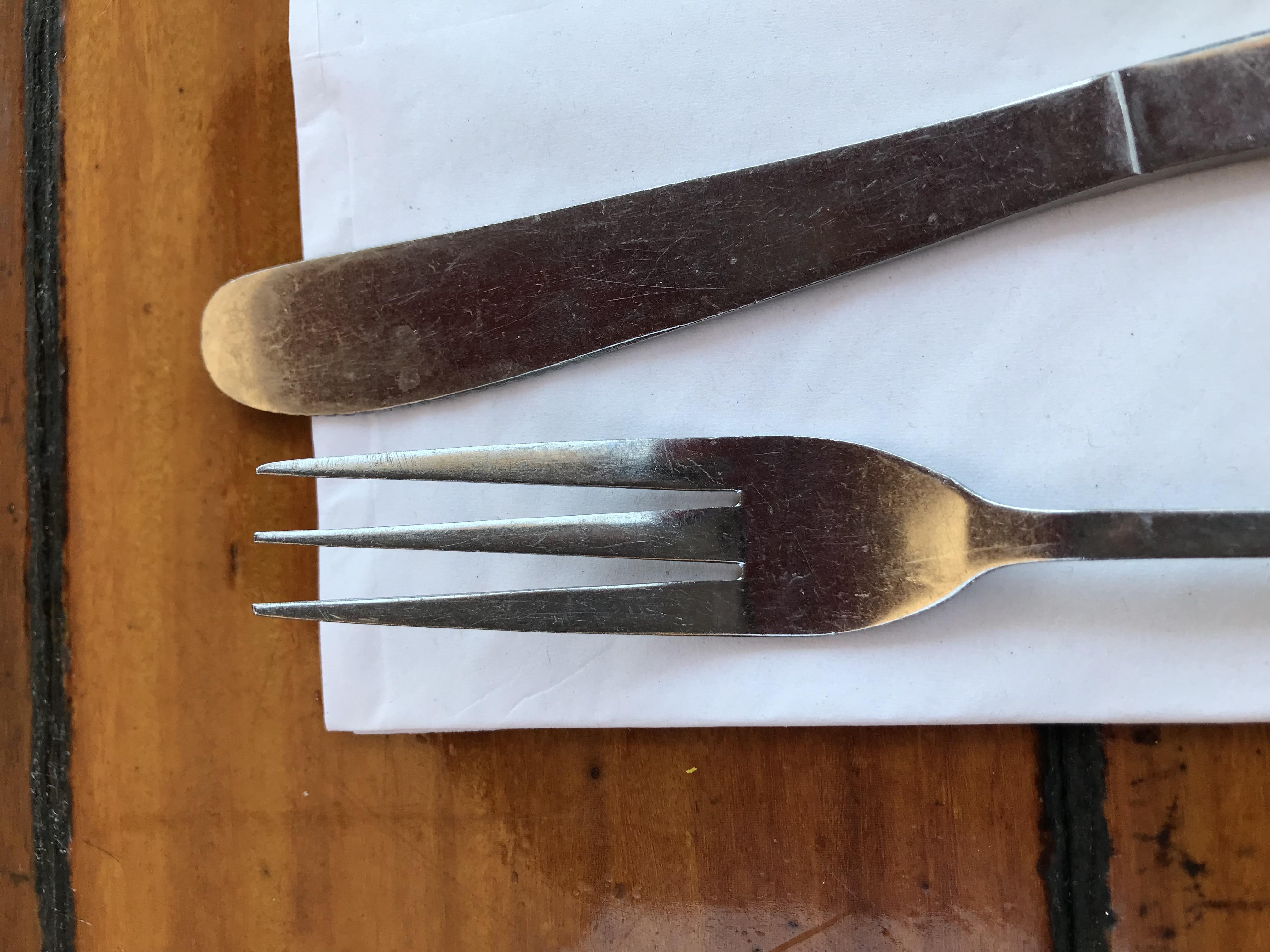 The forks at this restaurant have three prongs instead of four. r