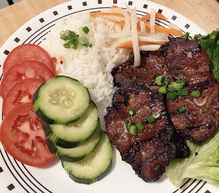 Grilled lemongrass pork shoulder with pickled daikon and carrot r