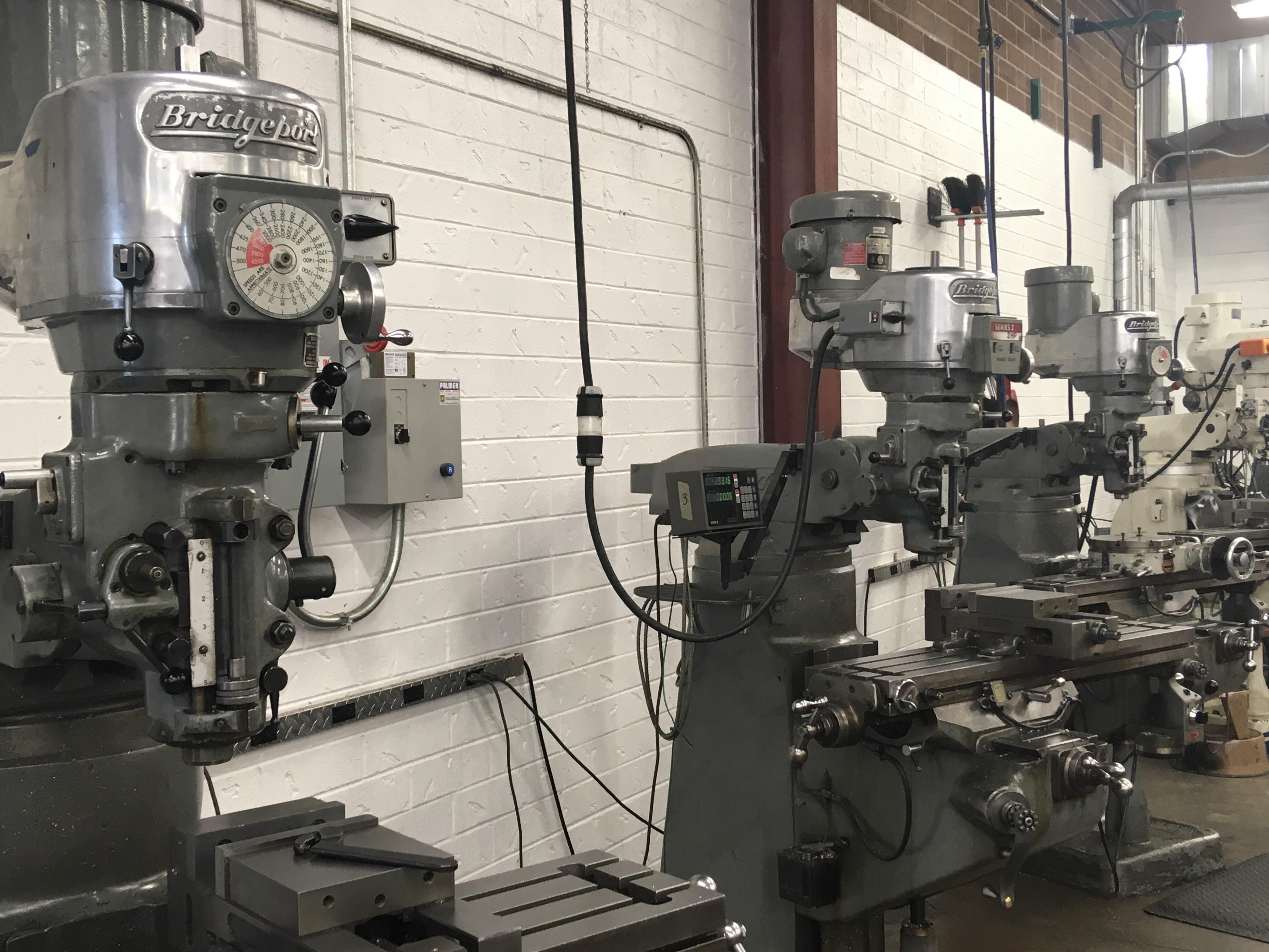 3 Bridgeport milling machines at my school. r/ave