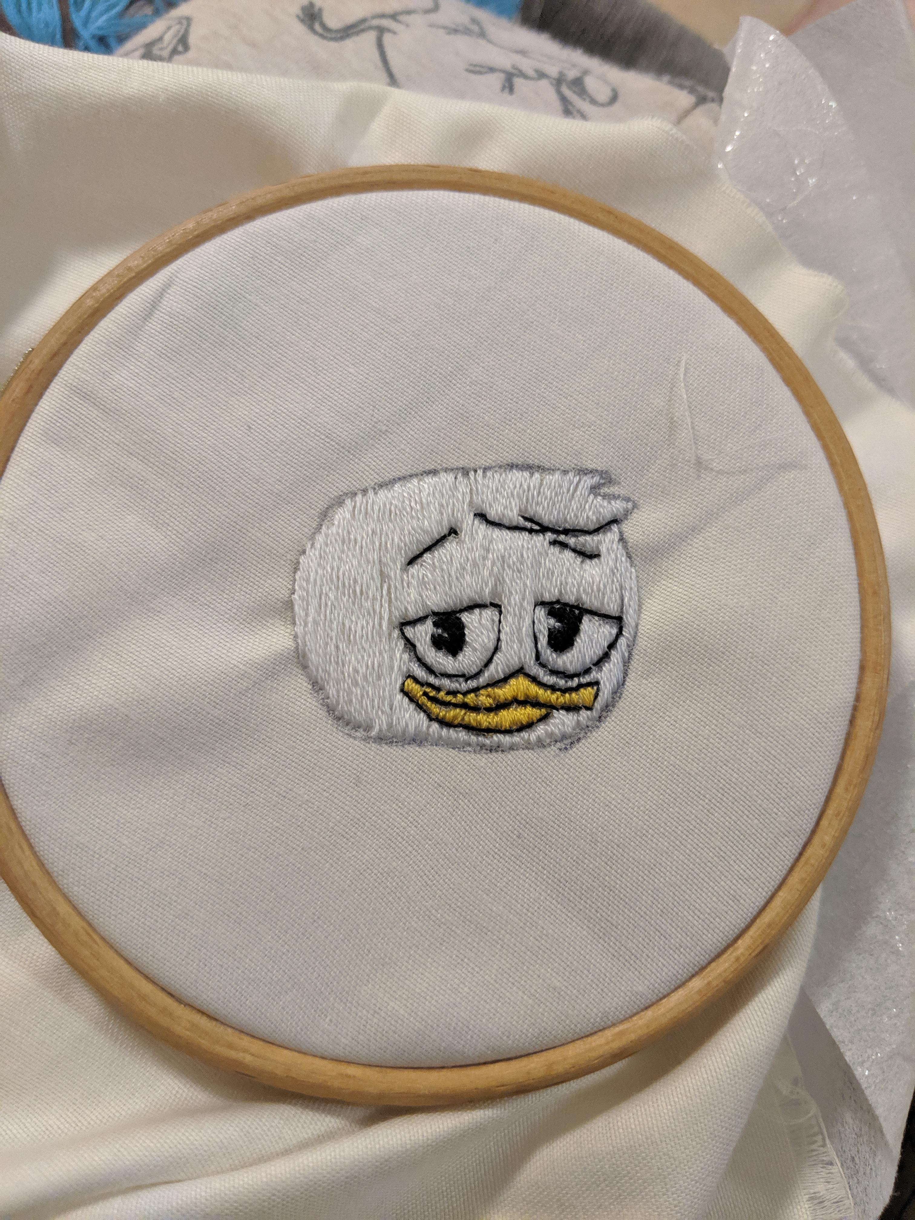 Hand sewing a patch to put on my son's tshirt r/ducktales