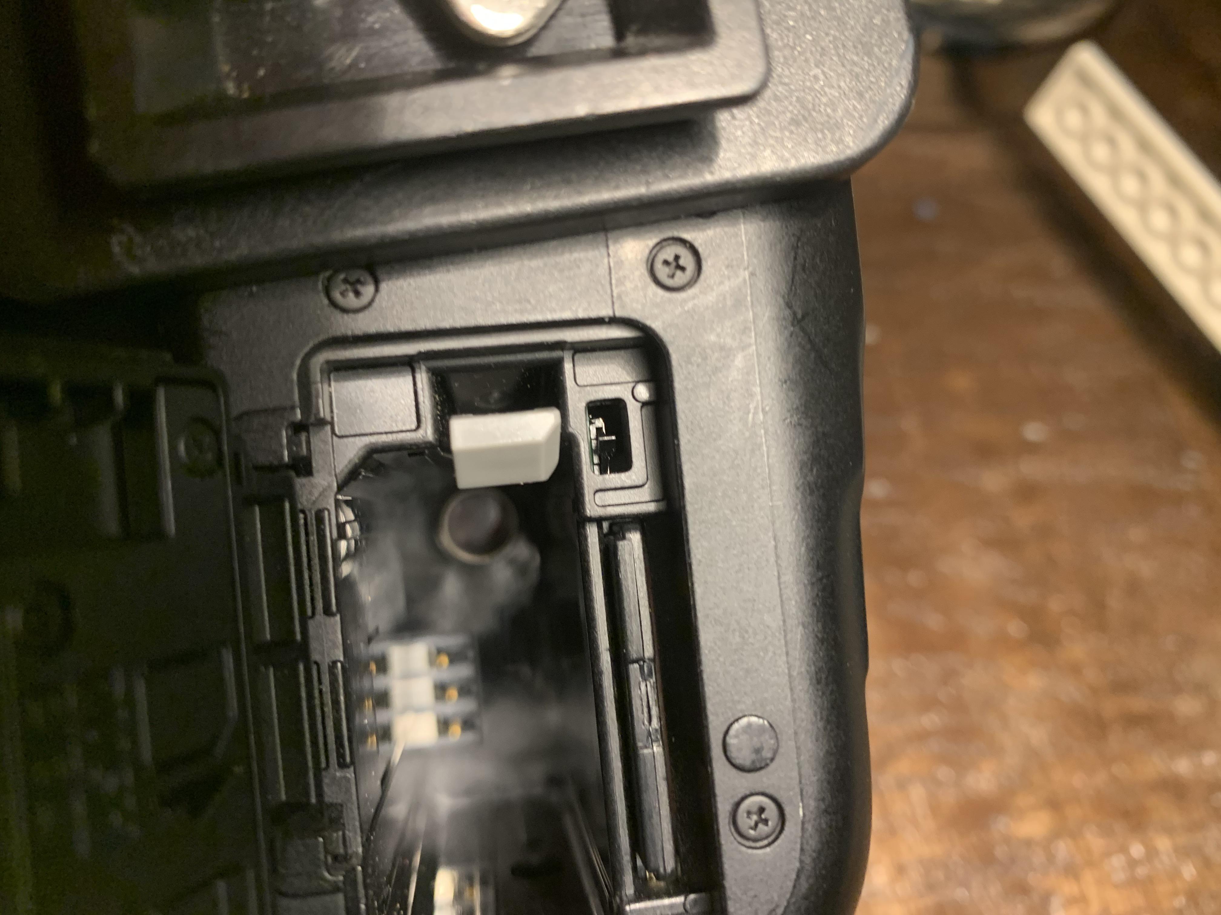 What does this switch do above battery port on my canon Rebel T6 ? r/canon
