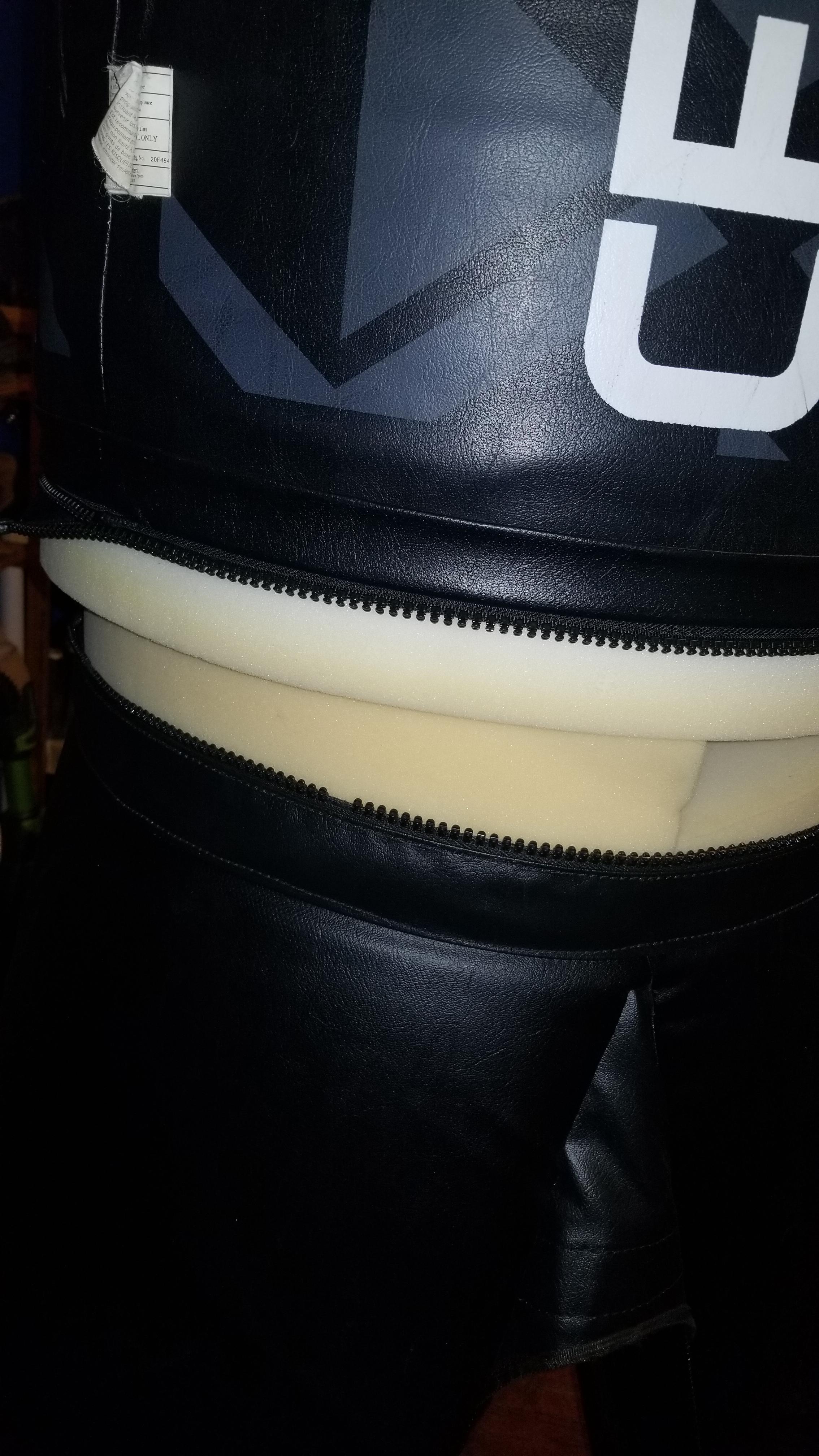 Broken zipper on a century punching bag. The zipper comes undone after a few punches and kicka