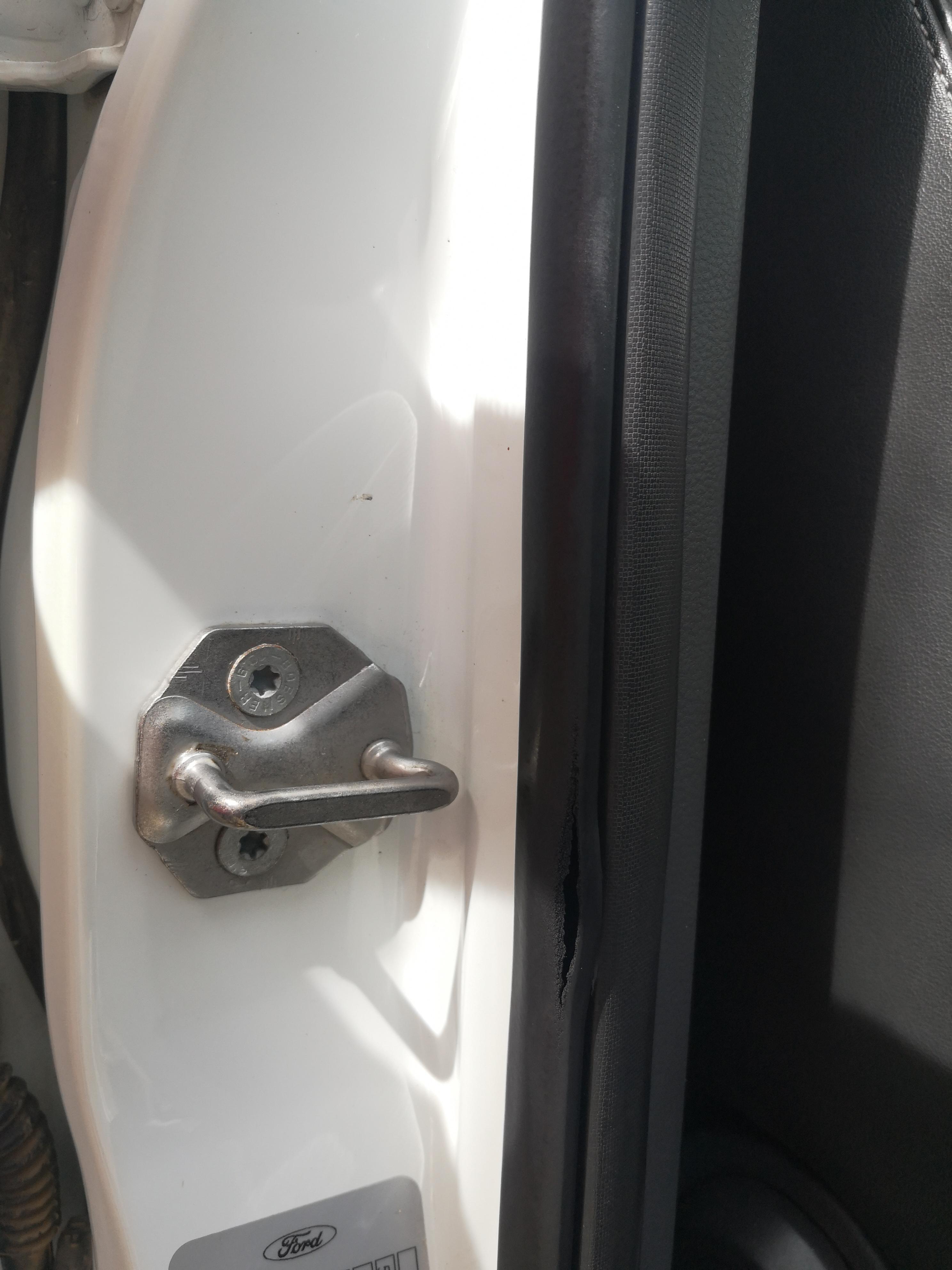 I noticed this tear on the driver door of a Ford Ranger (3.2 6 speed) 2013. I know it's