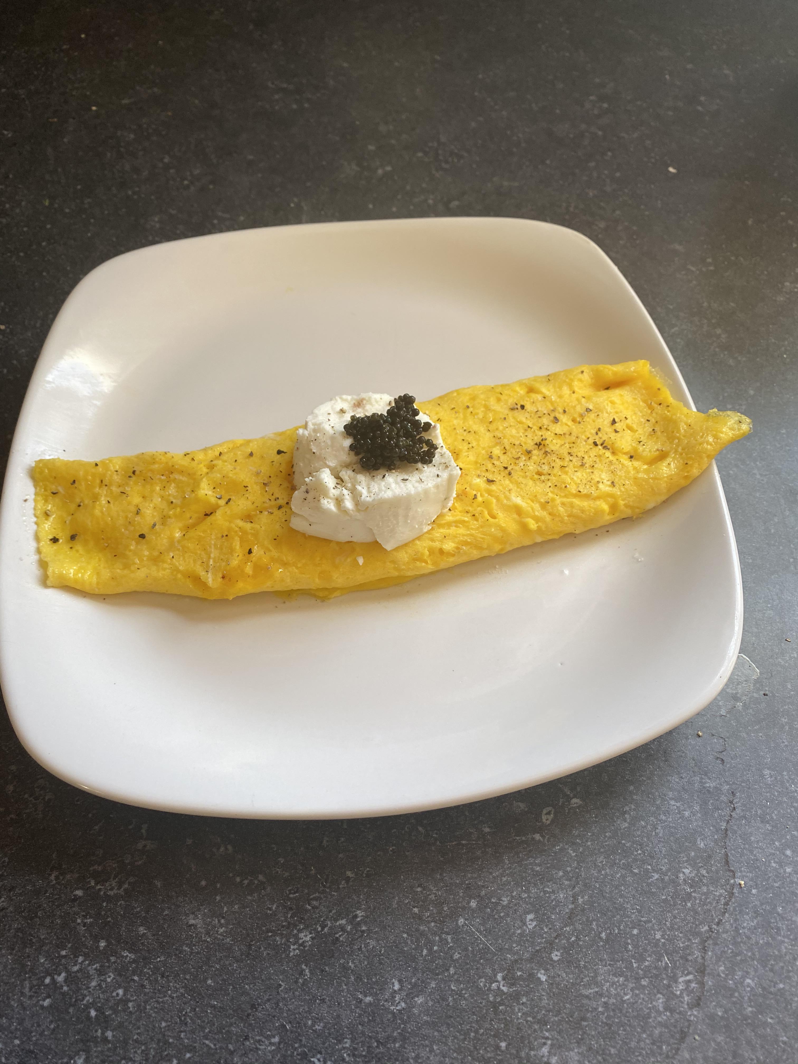 French omelet topped with goat cheese and caviar r/Omelettes